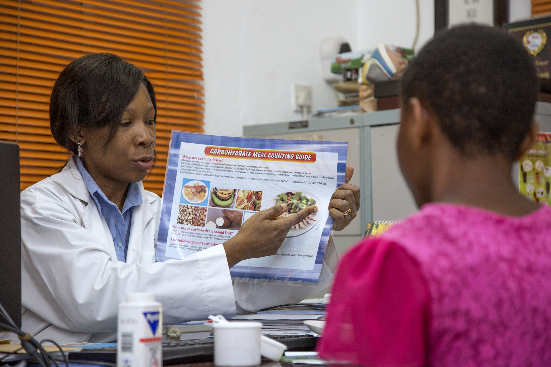 A doctor showing a patient an image