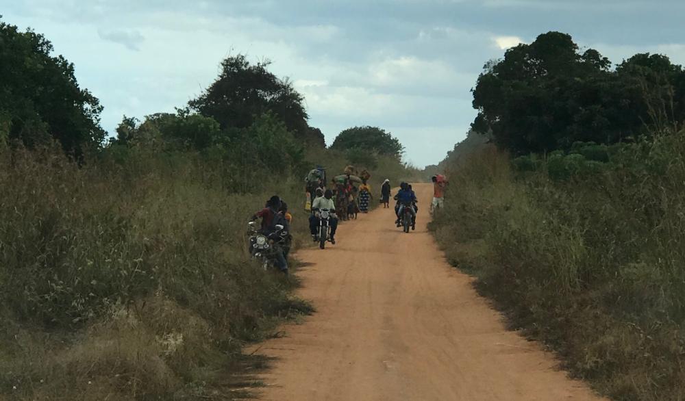 Residents of Naunde, in Macomia, Cabo Delgado, flee their village following an attack on June 5, 2018.