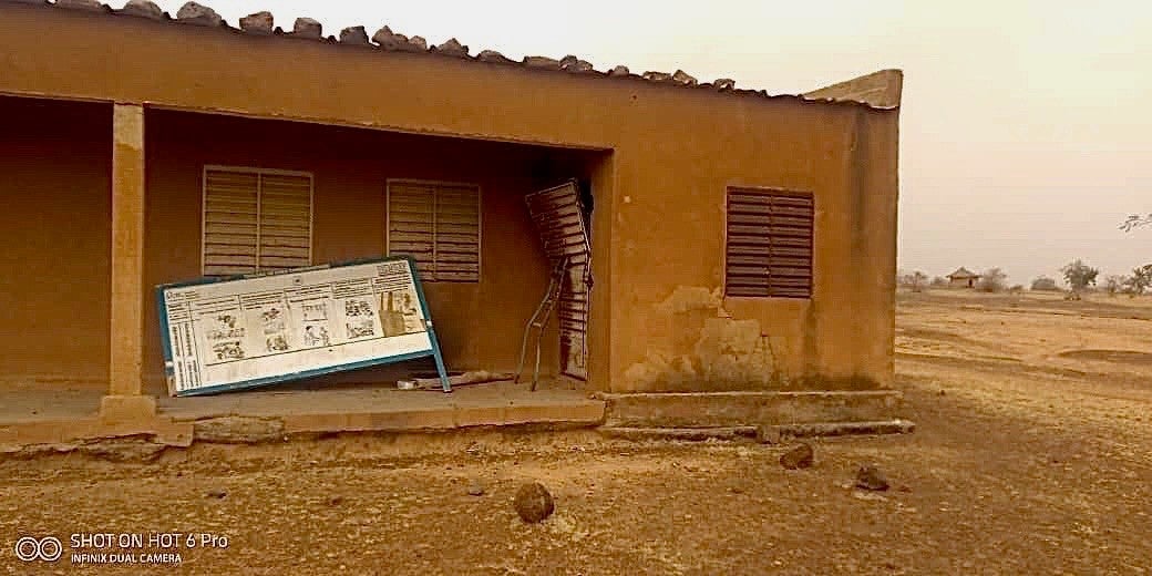 Exterior of a school with damaged doors