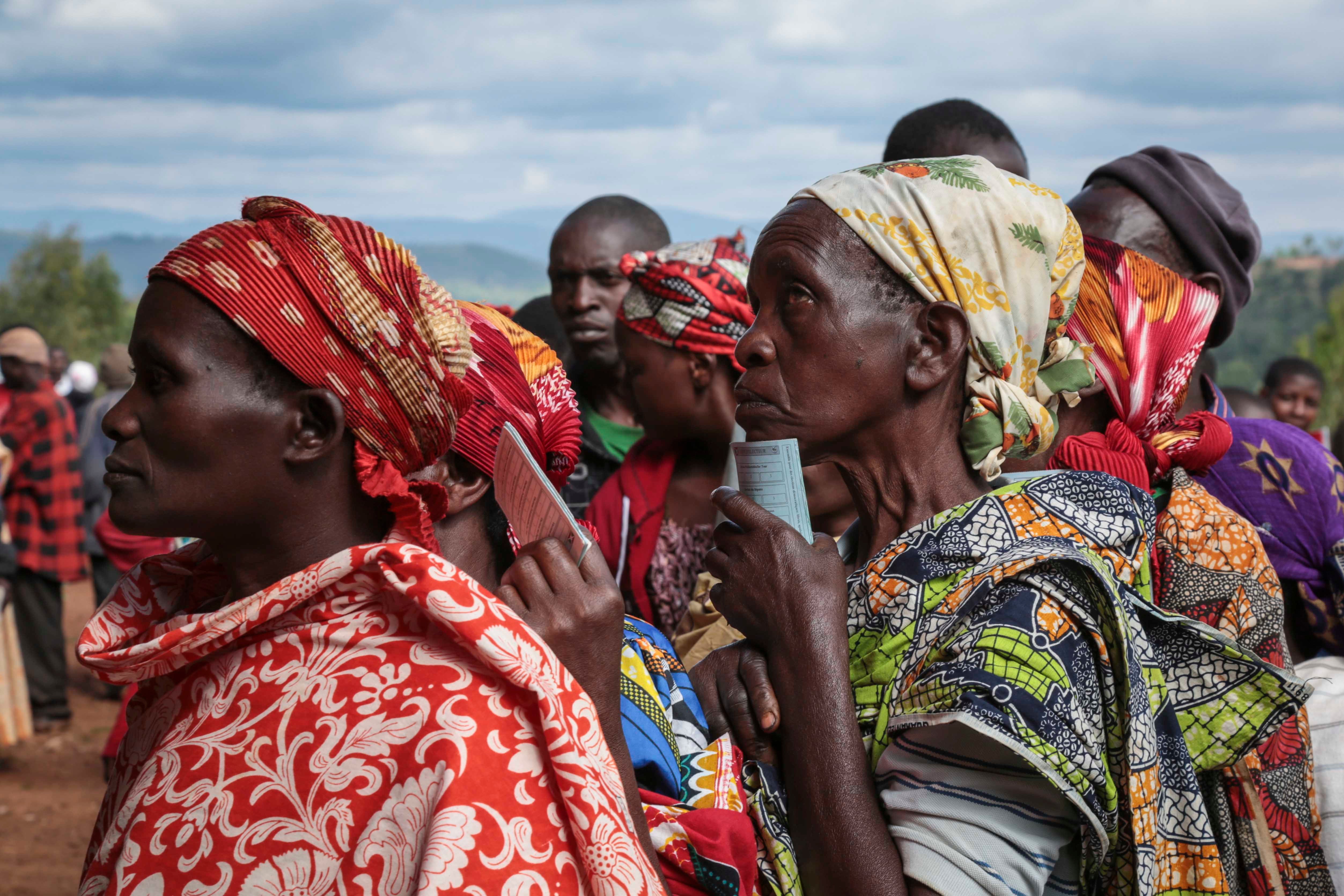 Women queue to cast their votes in the presidential election, in Giheta, Gitega province, Burundi, May 20, 2020.