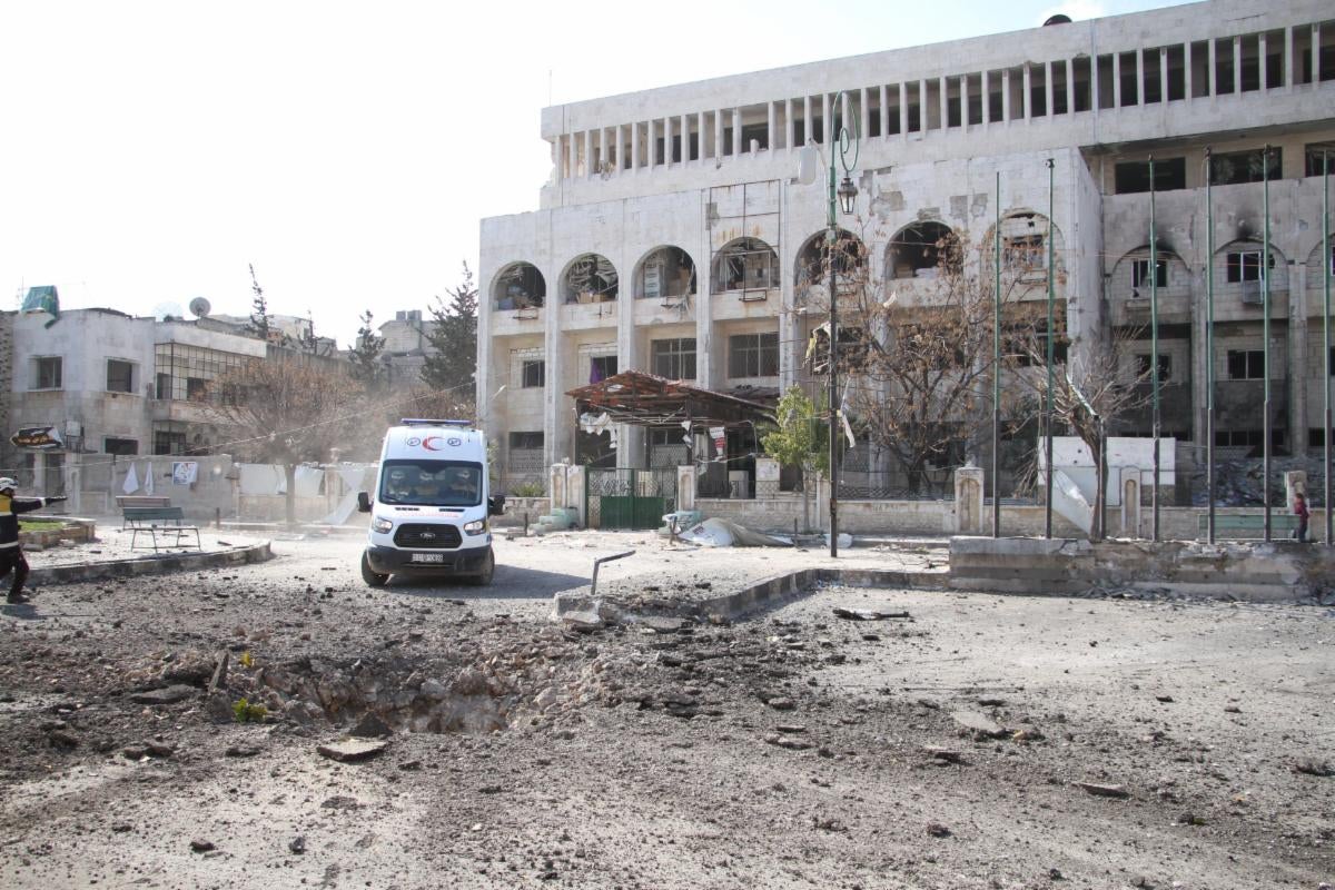 An ambulance in front of a hospital building