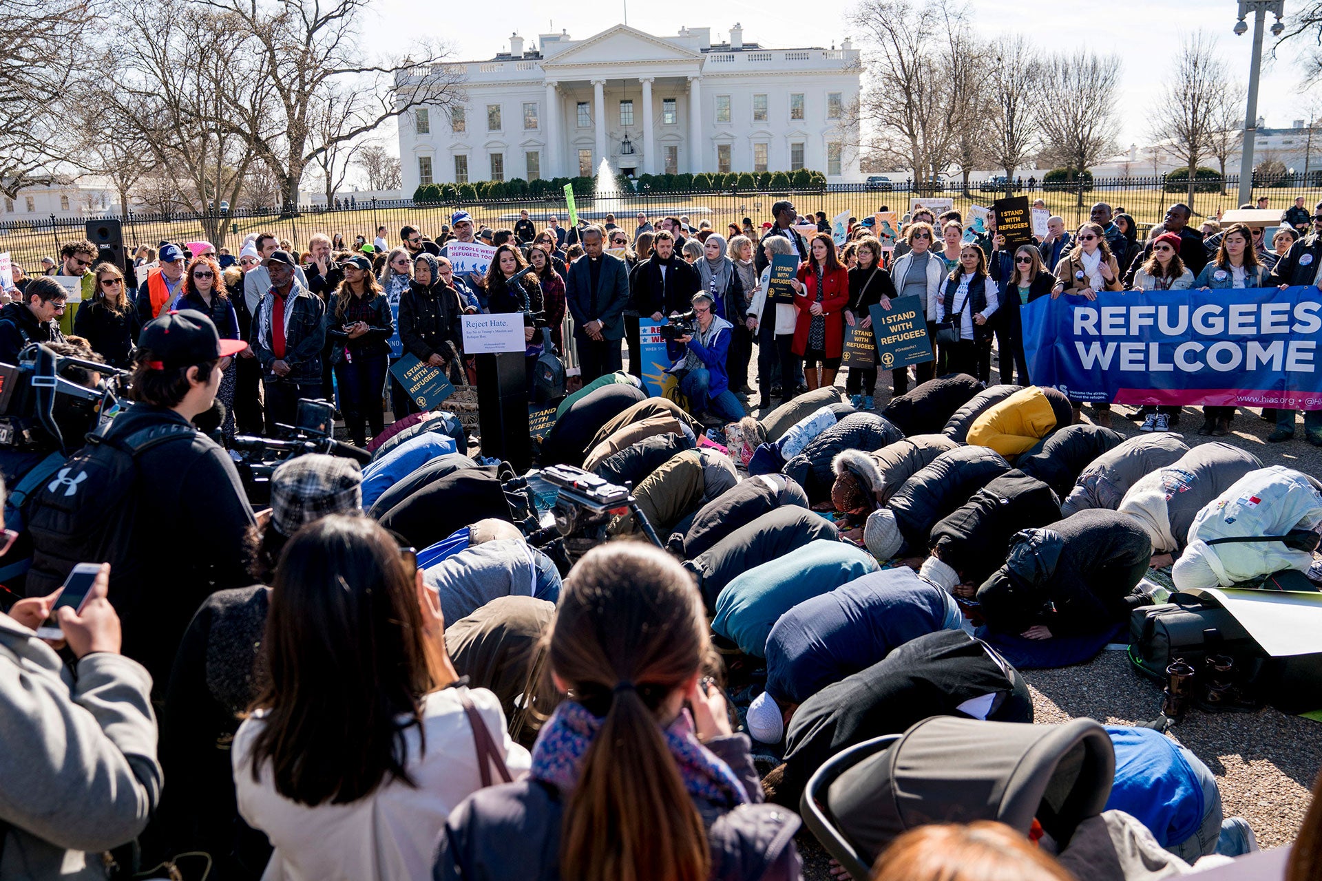In this file photo, people protest the Trump administration's refugee policies outside the White House in Washington, January 27, 2018. 