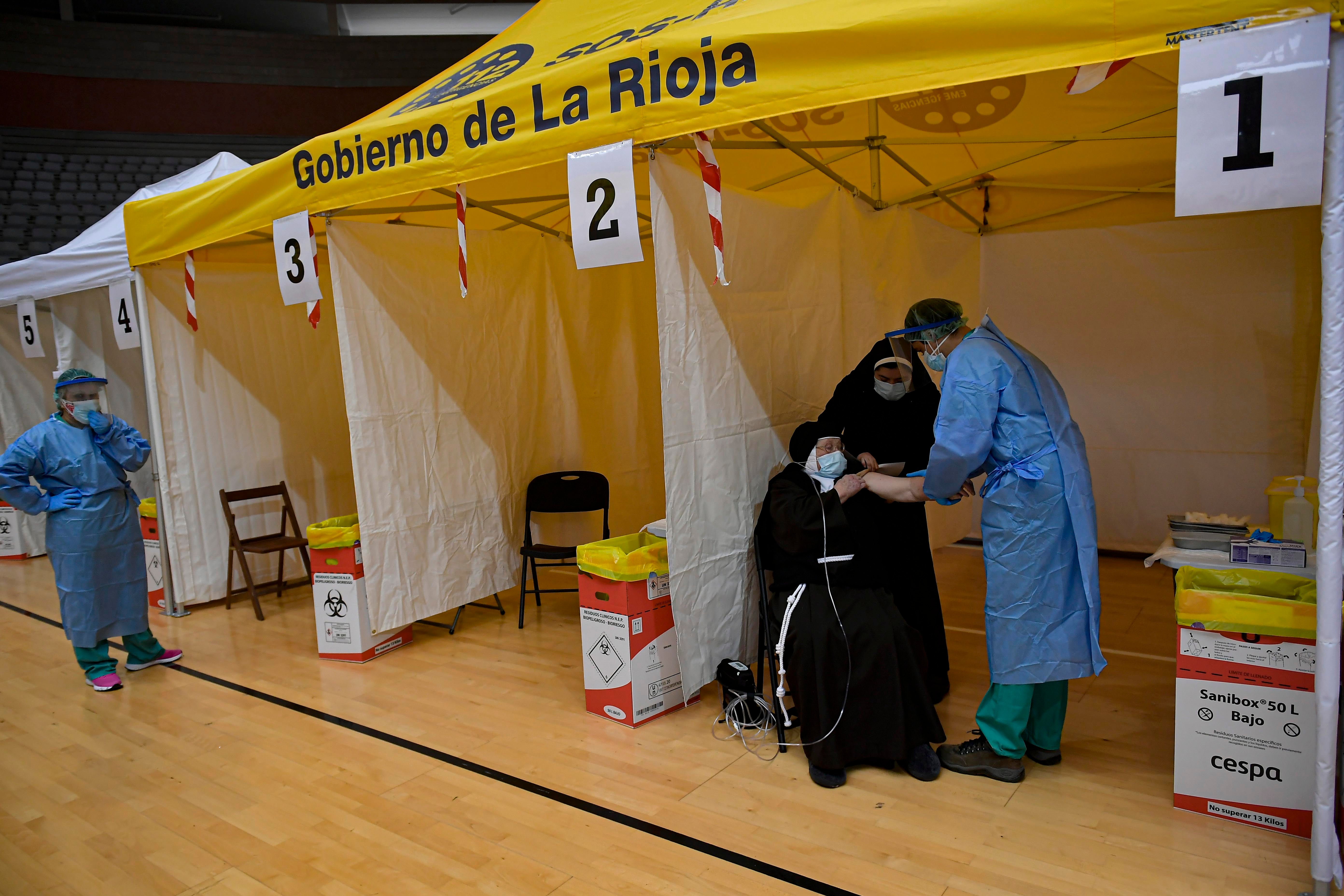 94-year-old Mother Teresa Llona receives a Pfizer vaccine during a Covid-19 vaccination campaign at the bull ring in Arnedo, northern Spain, March 4, 2021. 