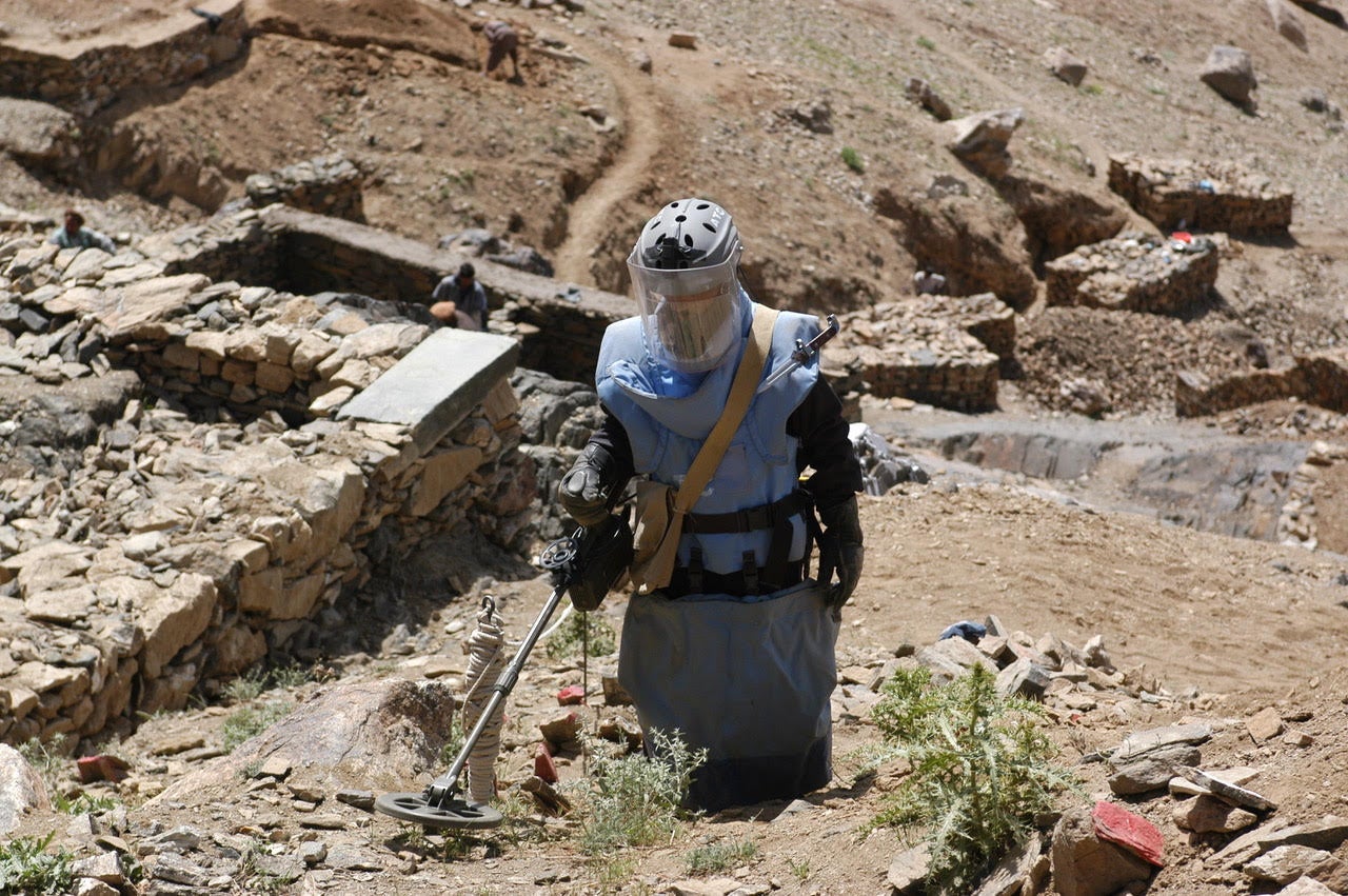 Clearance operator from the Halo Trust clearing a steep, rocky hillside in Afghanistan.