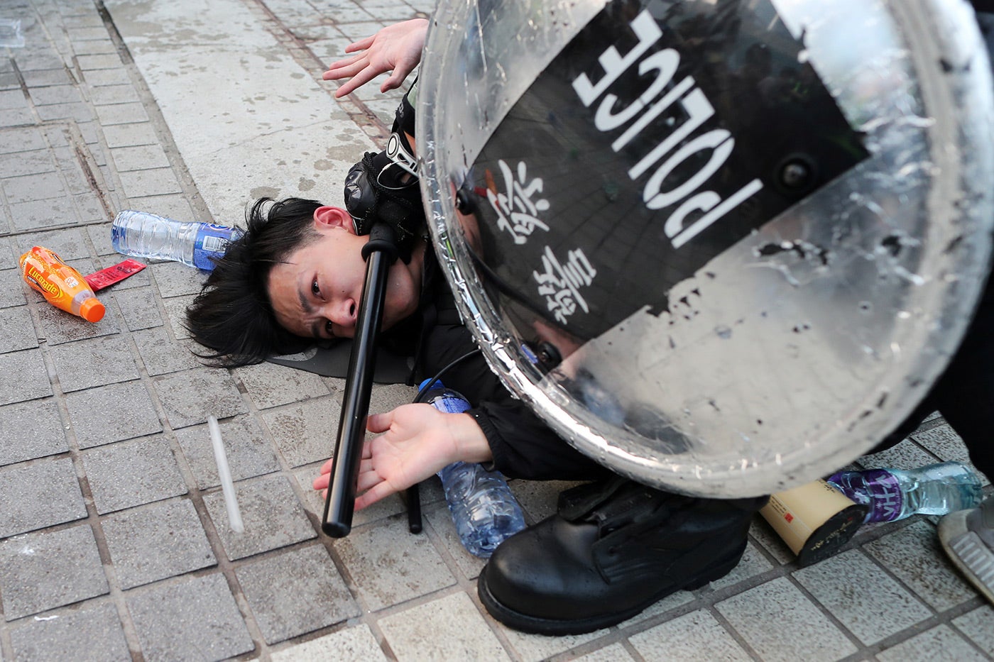 Police arrest a Hong Kong protester after a Chinese flag was removed from a flag&nbsp;pole at a&nbsp;Hong Kong&nbsp;rally in support of&nbsp;Xinjiang&nbsp;Uyghurs' human rights&nbsp;in Hong Kong, December 22, 2019.&nbsp;