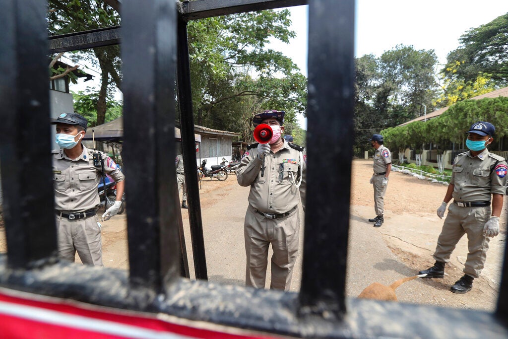 An official with a megaphone during the release of prisoners from Insein prison after a presidential pardon in Yangon