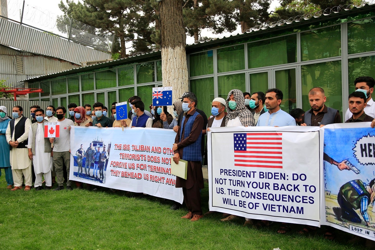 Former Afghan interpreters hold placards during a protest against the U.S. government and NATO in Kabul, Afghanistan on April 30, 2021.