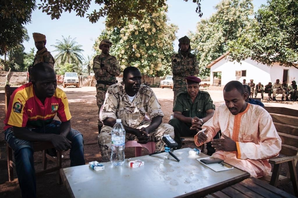 Hassan Bouba Ali (R) with Ali Darassa (C) surrounded by other UPC leaders, during a meeting at their headquarters in Alindao, October 2017. 