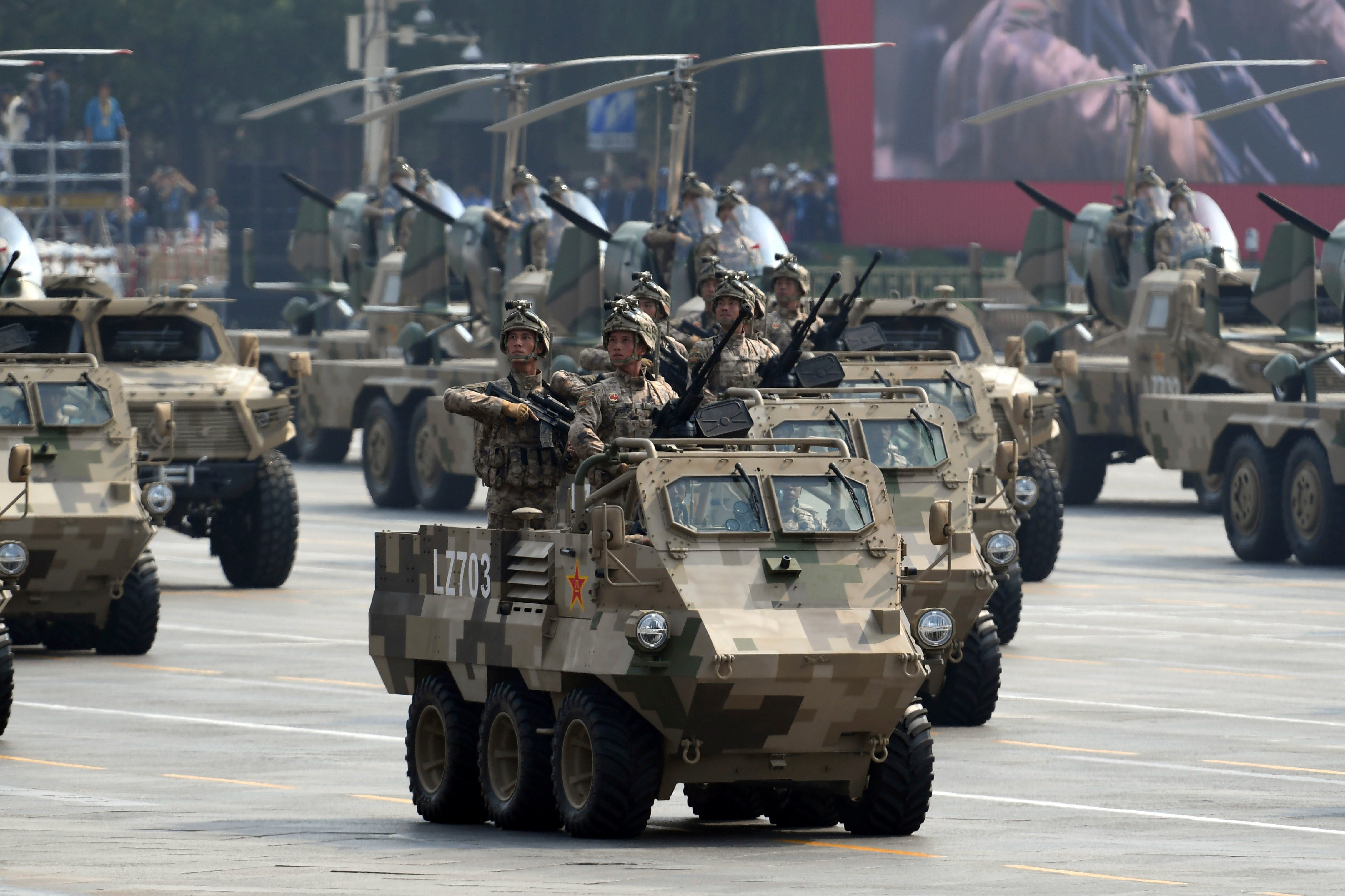 Soldiers in military tanks 