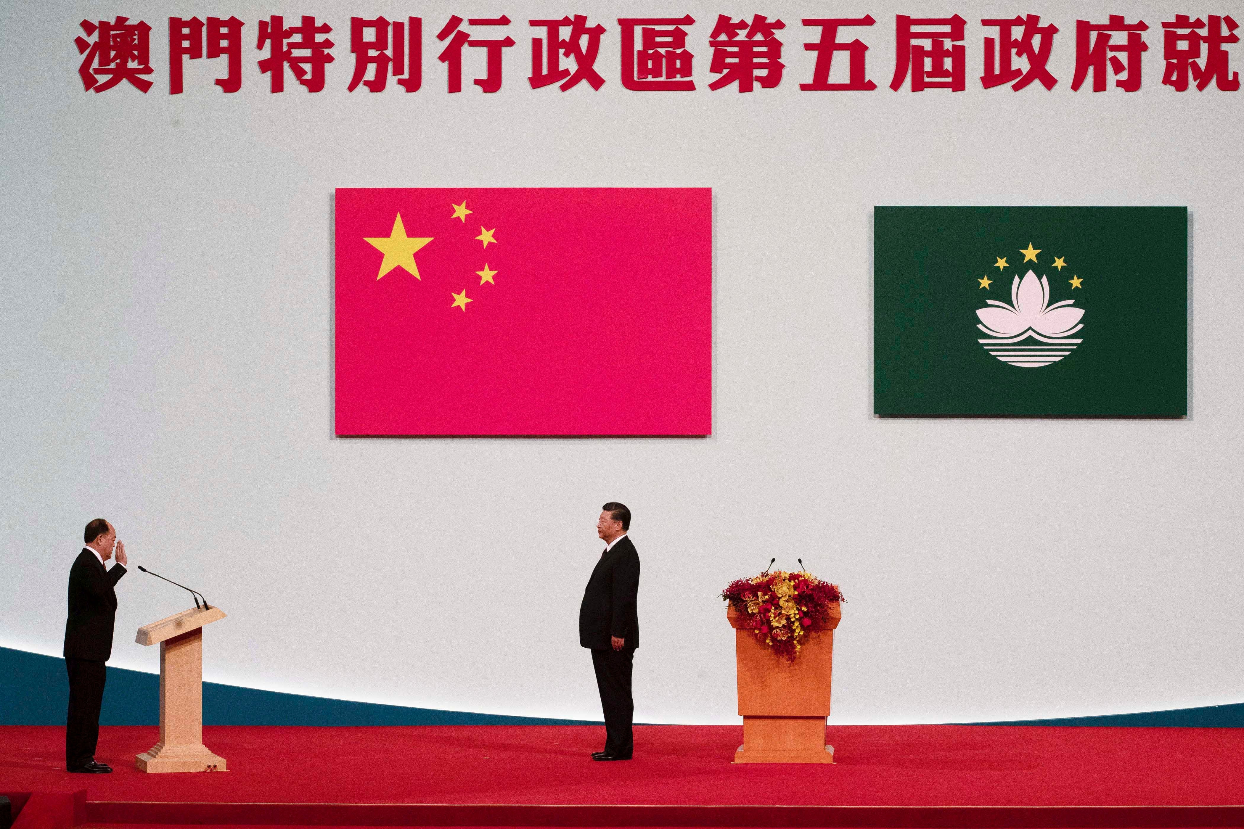 Macao Chief Executive Ho Iat Seng, left, reads his oath of office in front of Chinese leader Xi Jinping at the inauguration ceremony in Macao, December 20, 2019.