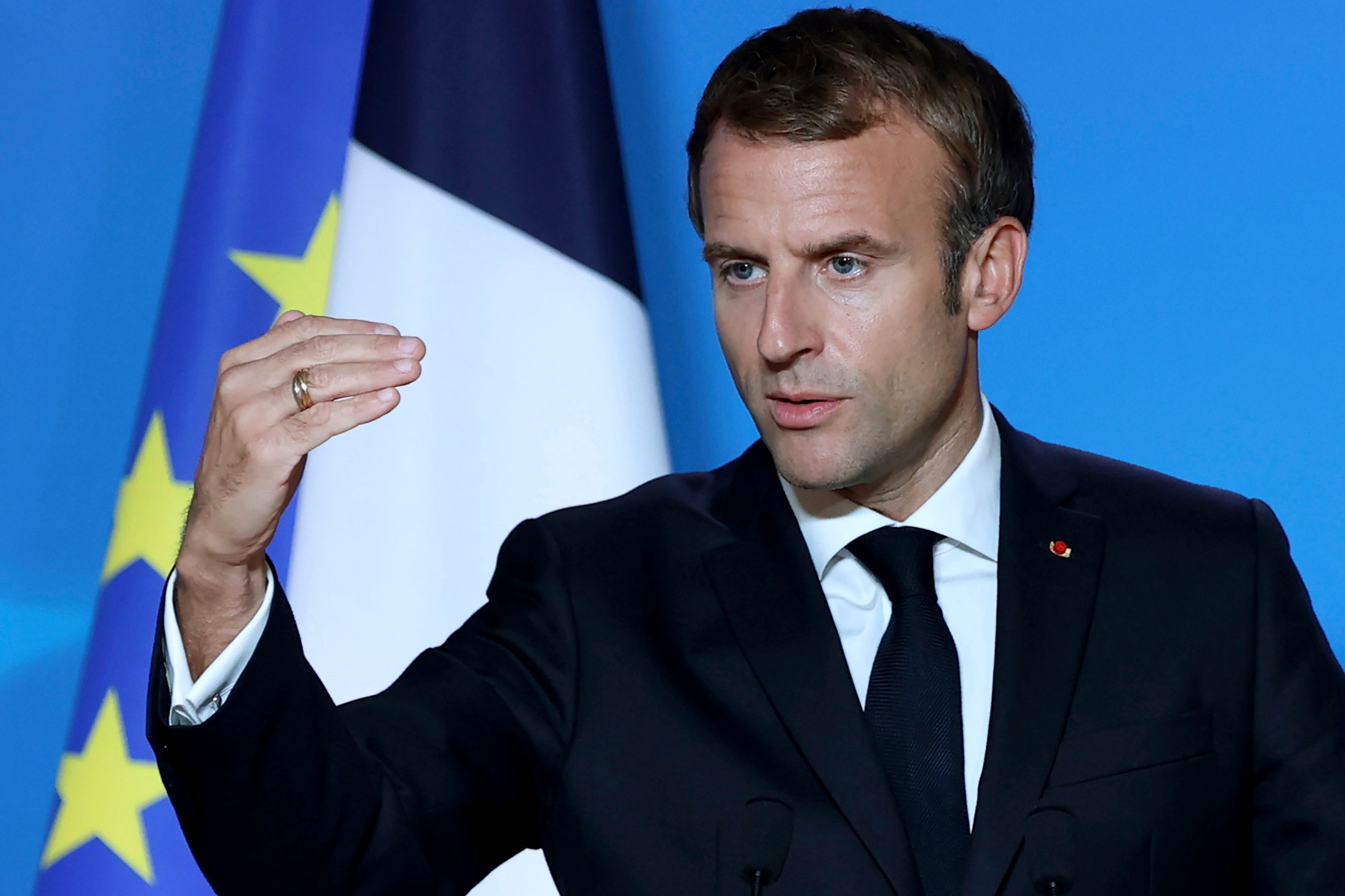 French President Emmanuel Macron speaks during a media conference at an EU summit in Brussels, October 22, 2021.