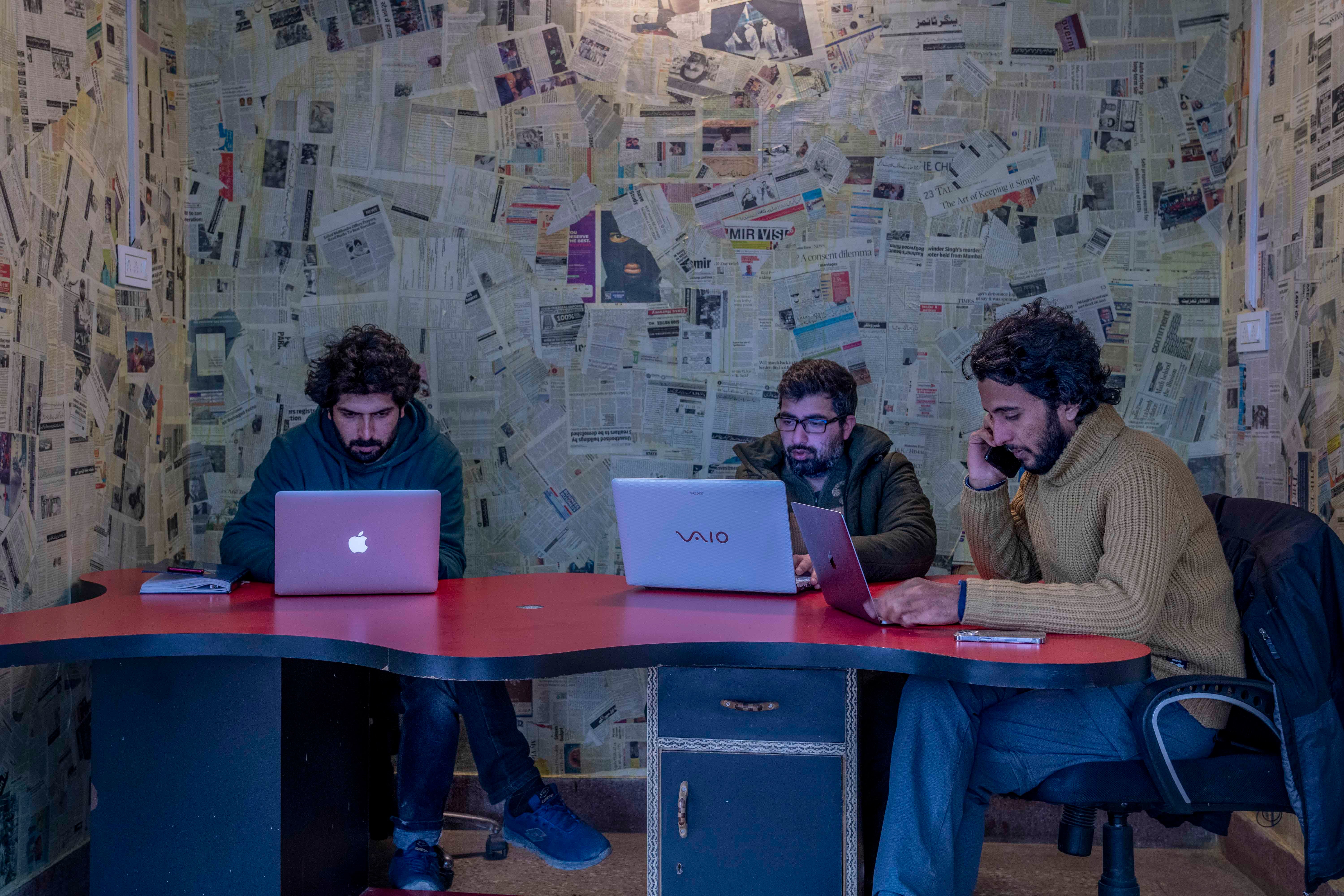 Fahad Shah, right, editor-in-chief of the Kashmir-based news website, The Kashmir Walla, in his office in Srinagar, India, January 21, 2022.