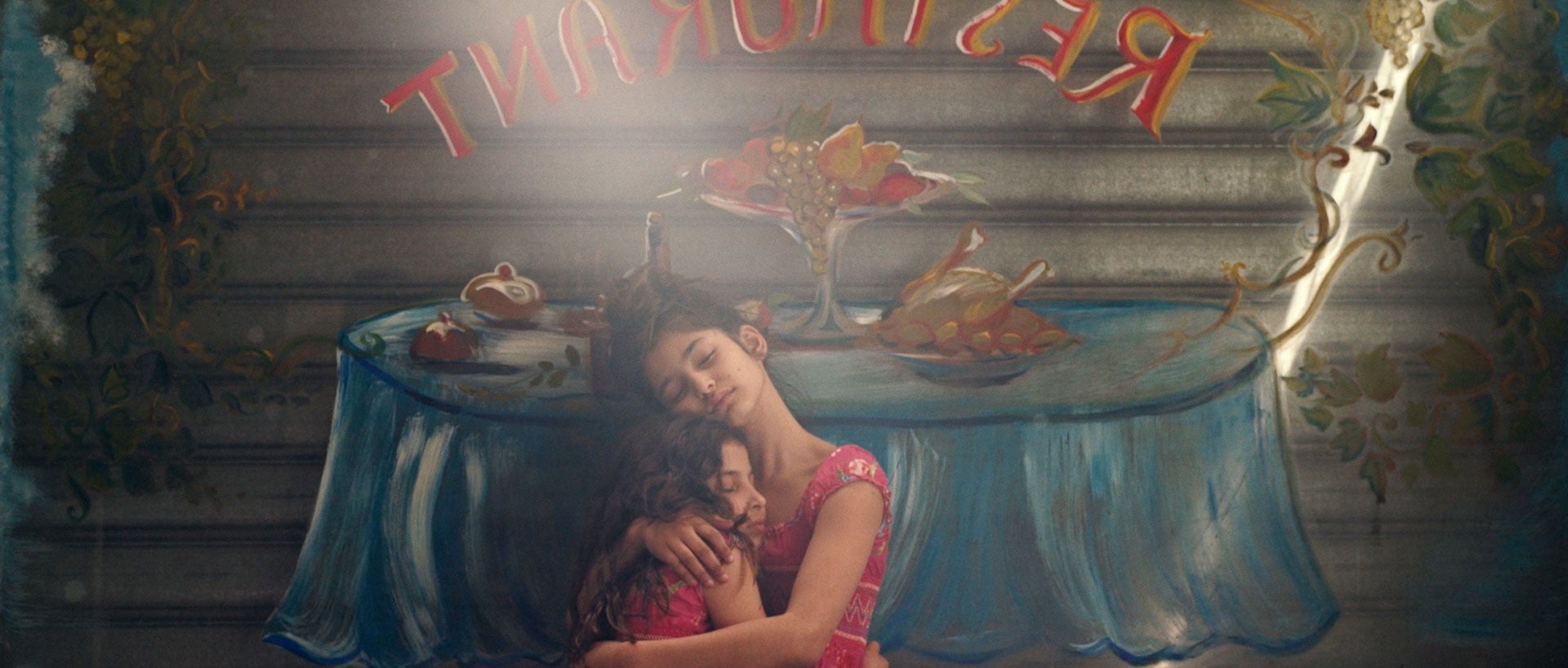 You Resemble Me screengrab of two girls embracing