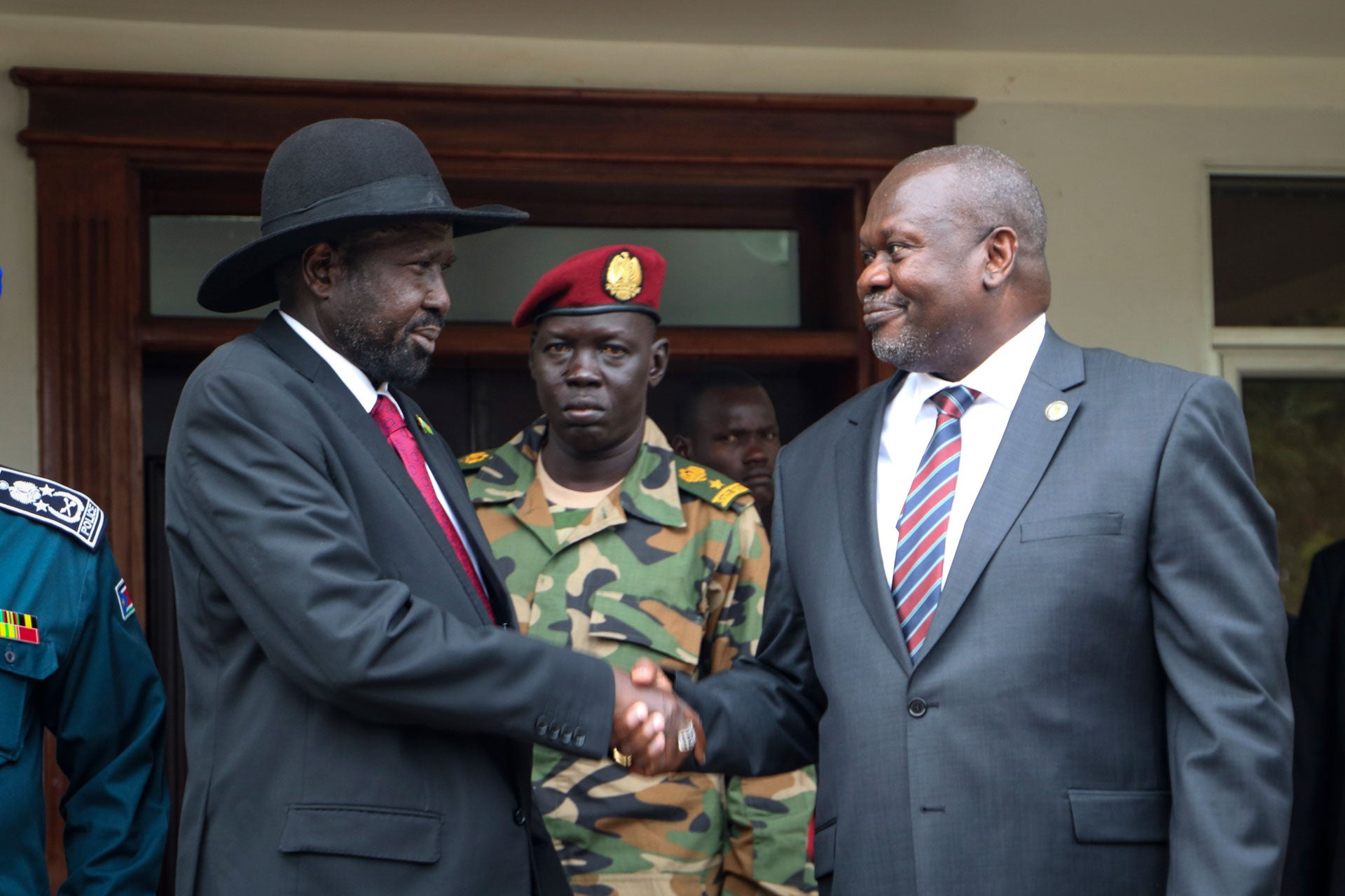 South Sudan's president Salva Kiir, left, and vice-president Riek Machar, right, shake hands