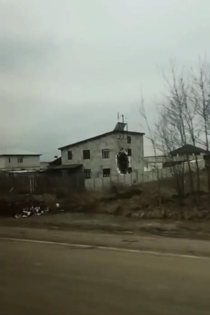A shot of a destroyed home from the road
