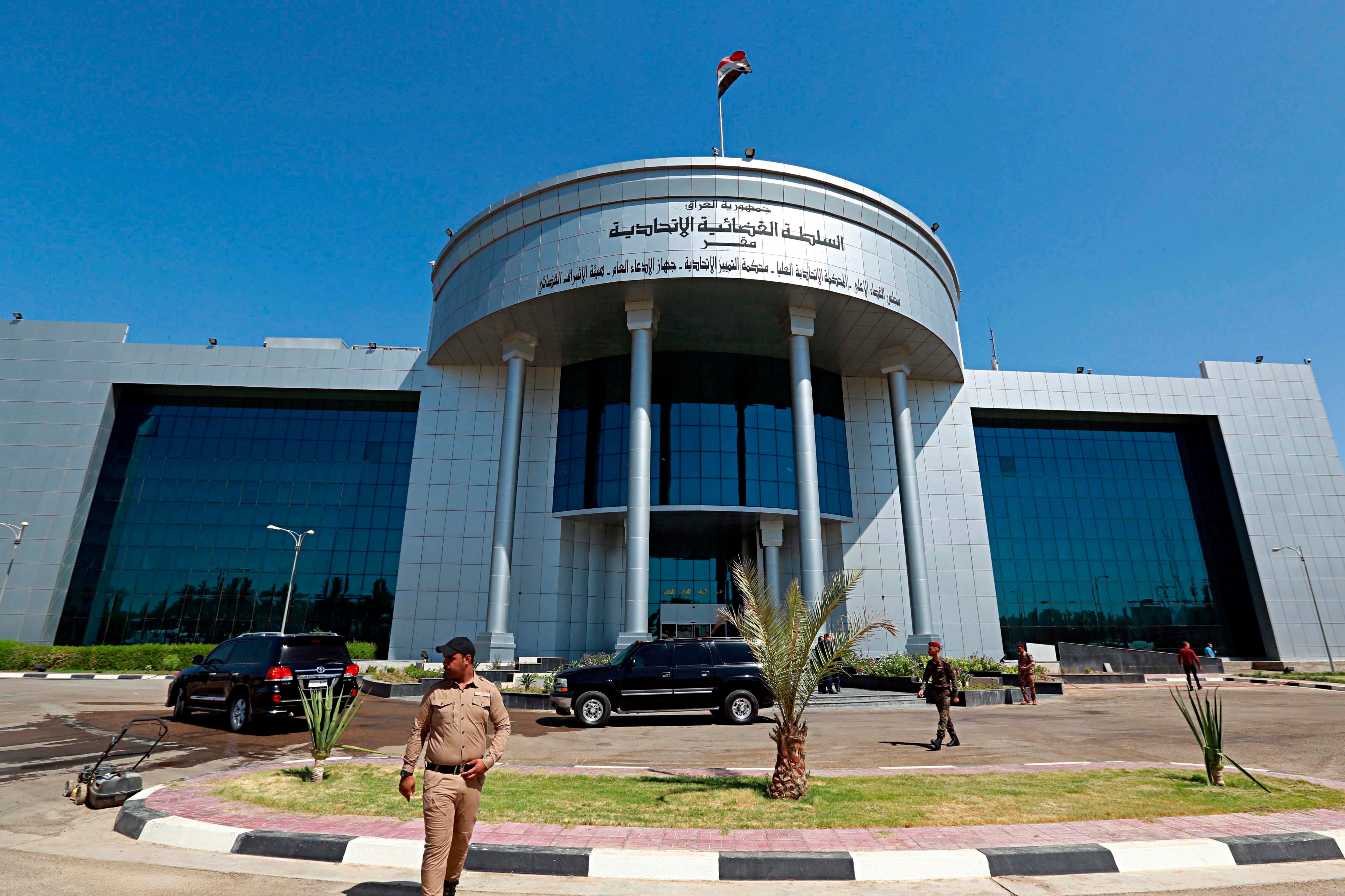 A security officer stands outside a building