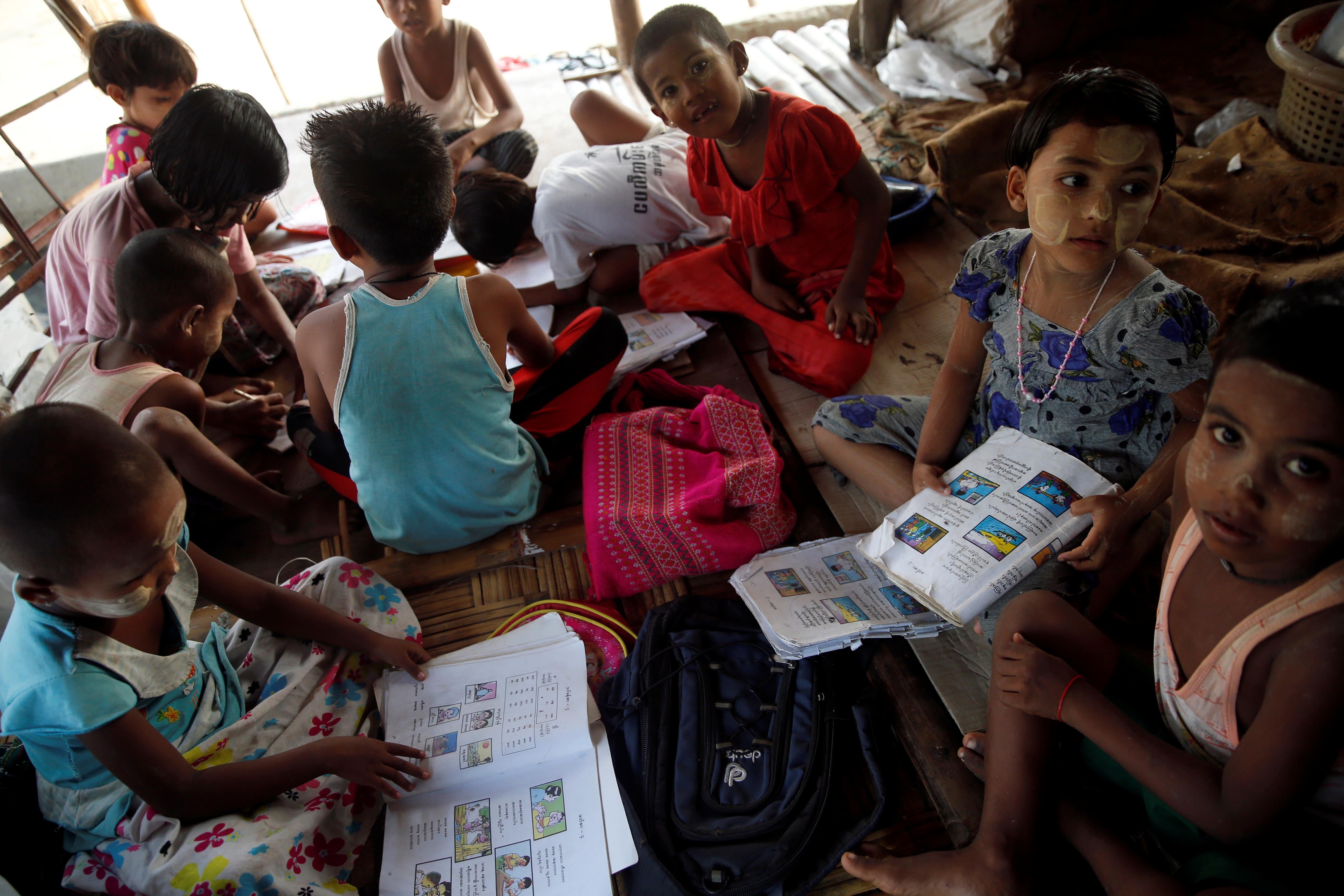 Children attend a class in a camp