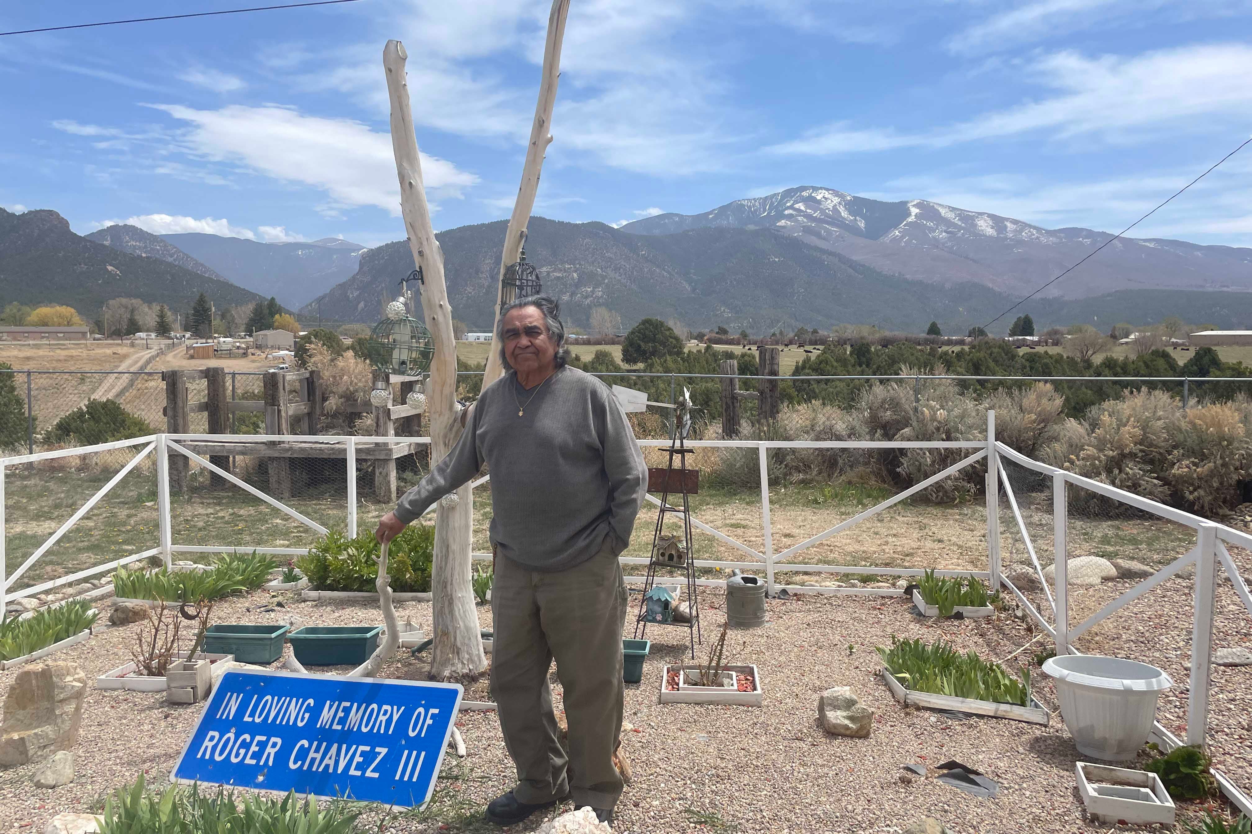 A man stands in a garden