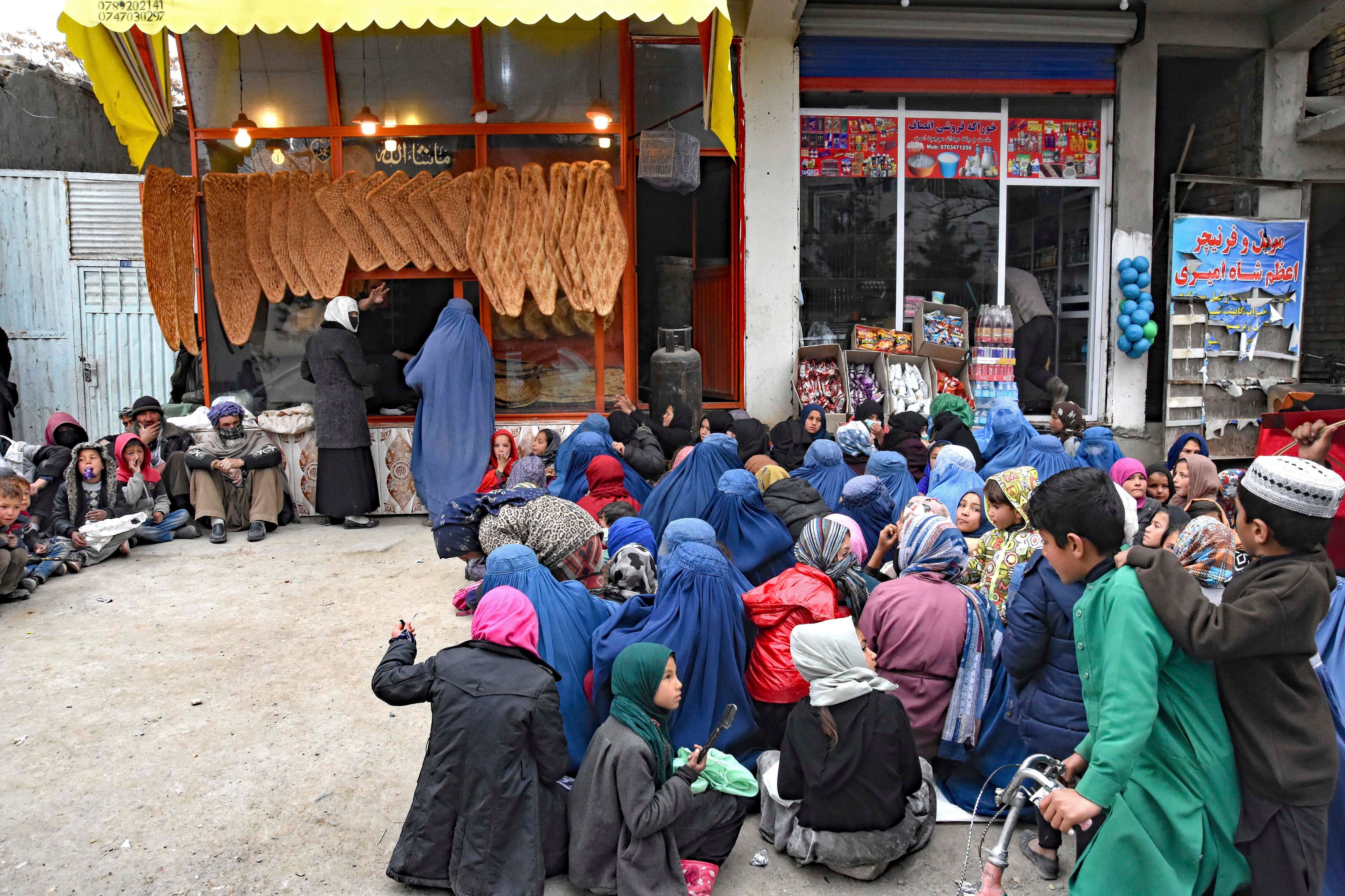 Women and children in need of food outside a bakery in Kabul, Afghanistan, February 28, 2022.