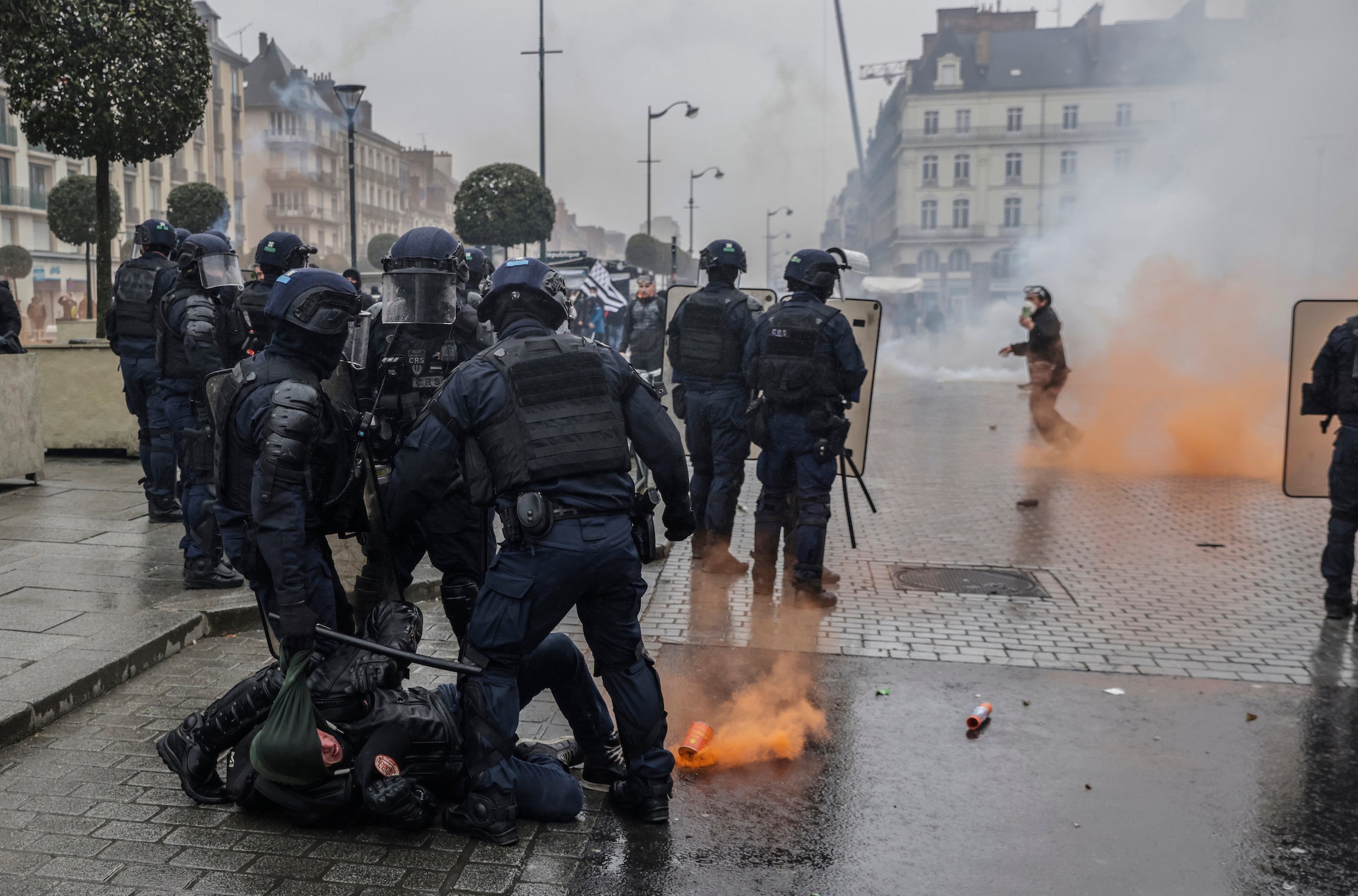 Riot police scuffle with protesters during a protest in Rennes, France.