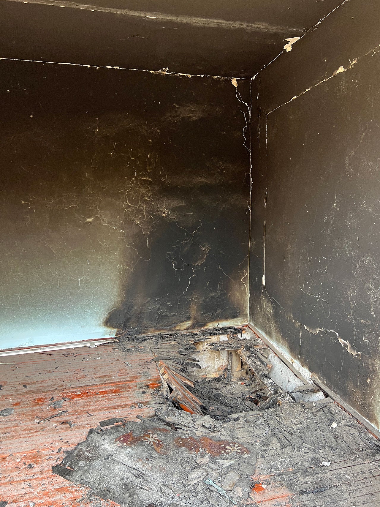 Fire damage in a house in the Kyrgyz village of Ak-Sai. Many homes had such damage from what appeared to be deliberate burning by Tajik forces on September 16, 2022.