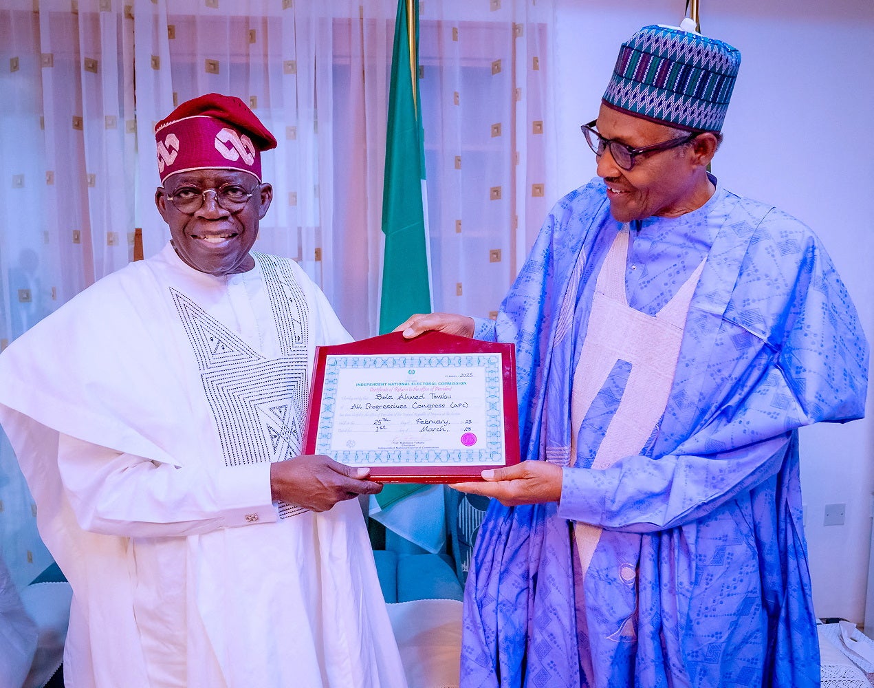 Nigerian President Muhammadu Buhari (R) and Nigeria's newly declared winner of 2023 presidential election, Bola Ahmed Tinubu (L) pose for a photograph in Daura, Nigeria, March 1, 2023. 