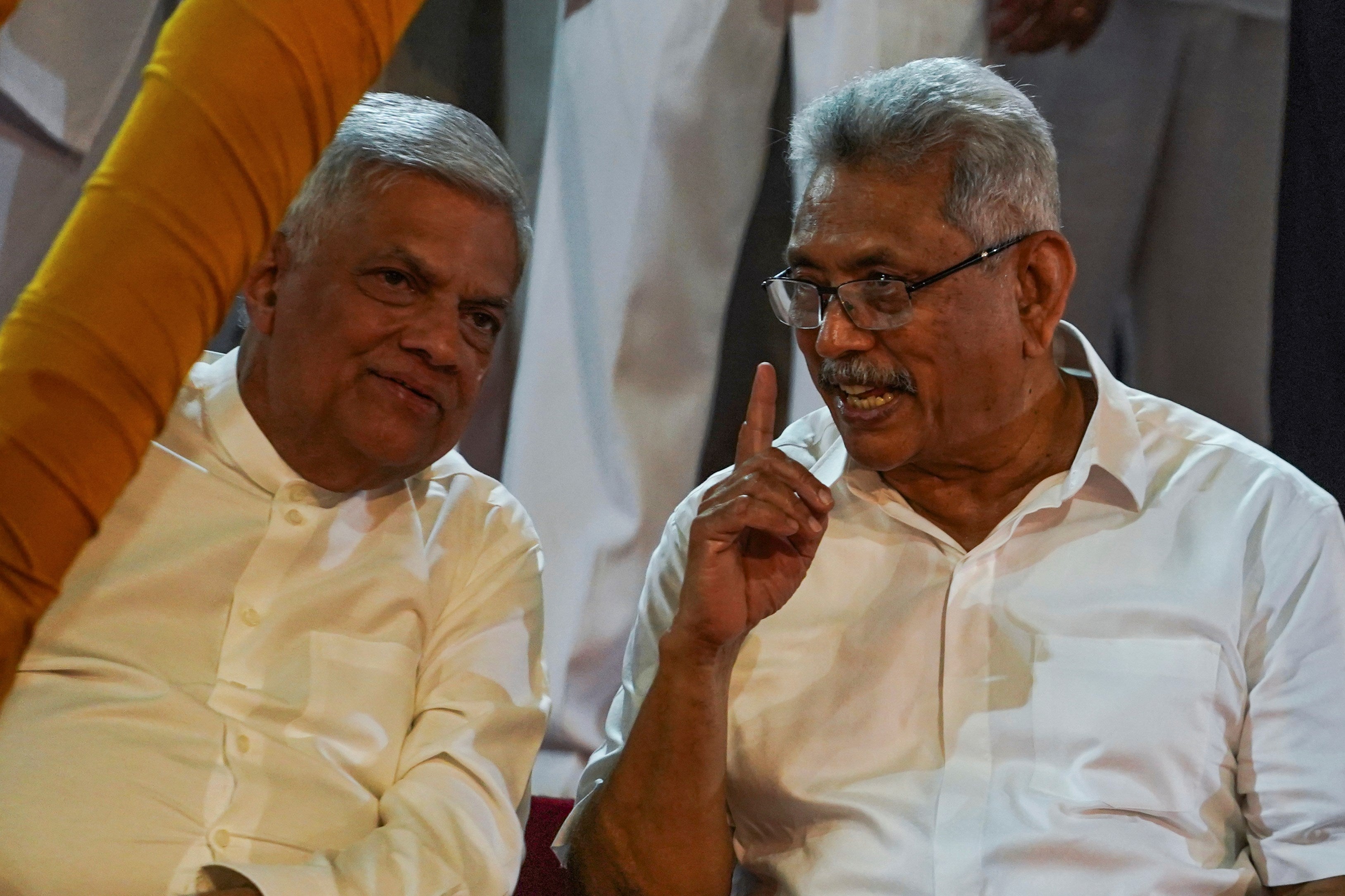 202307asia_srilanka_wickremesinghe_rajapaksa