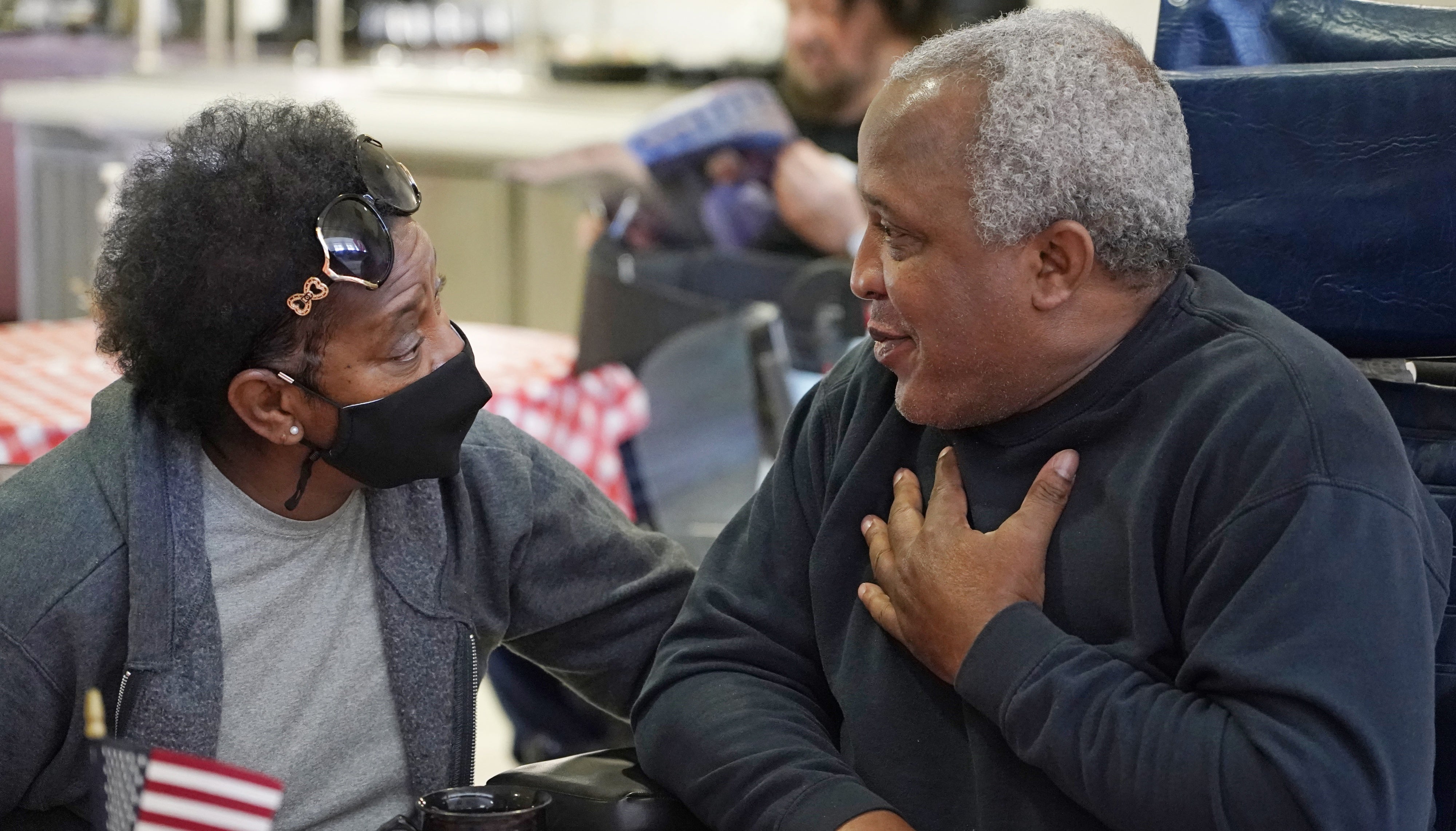 A couple speaks at the Mississippi State Veterans Home in Collins, Mississippi, April 1, 2021. 