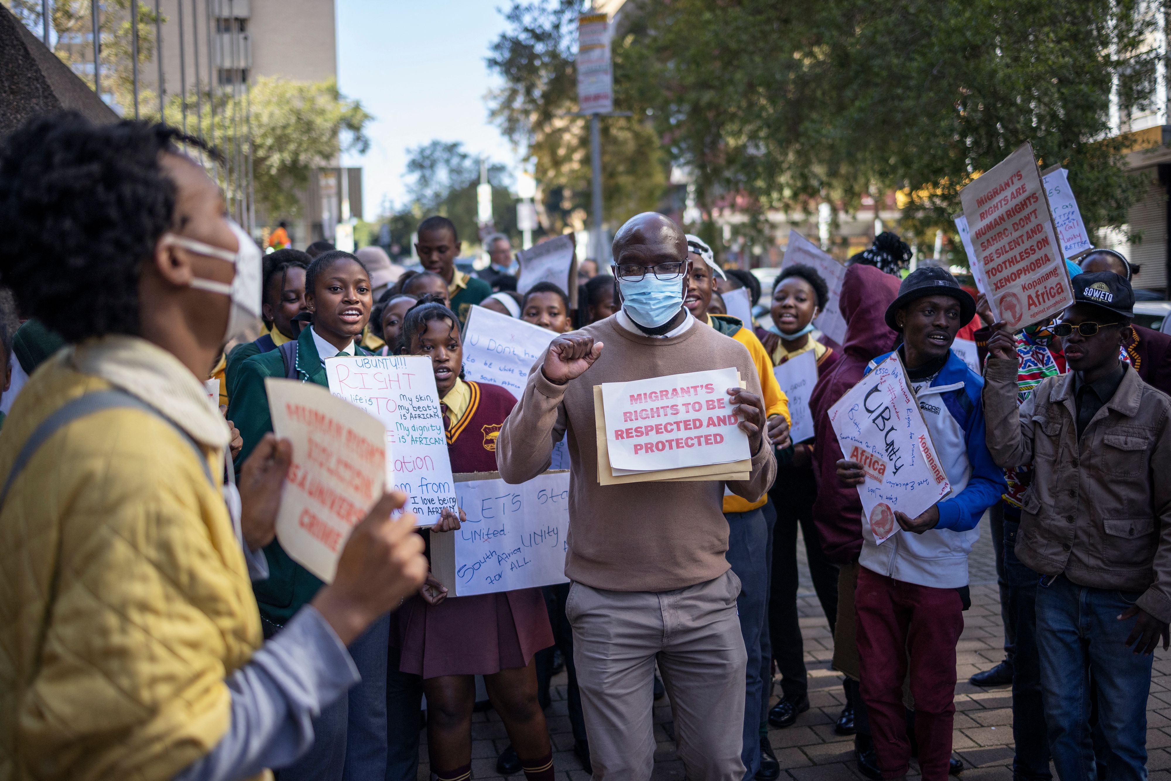 Protestors demonstrate in front of the South African Human Rights Commission (SAHRC) against xenophobia and vigilantism in the country, Johannesburg, during Africa Day, May 25, 2022.