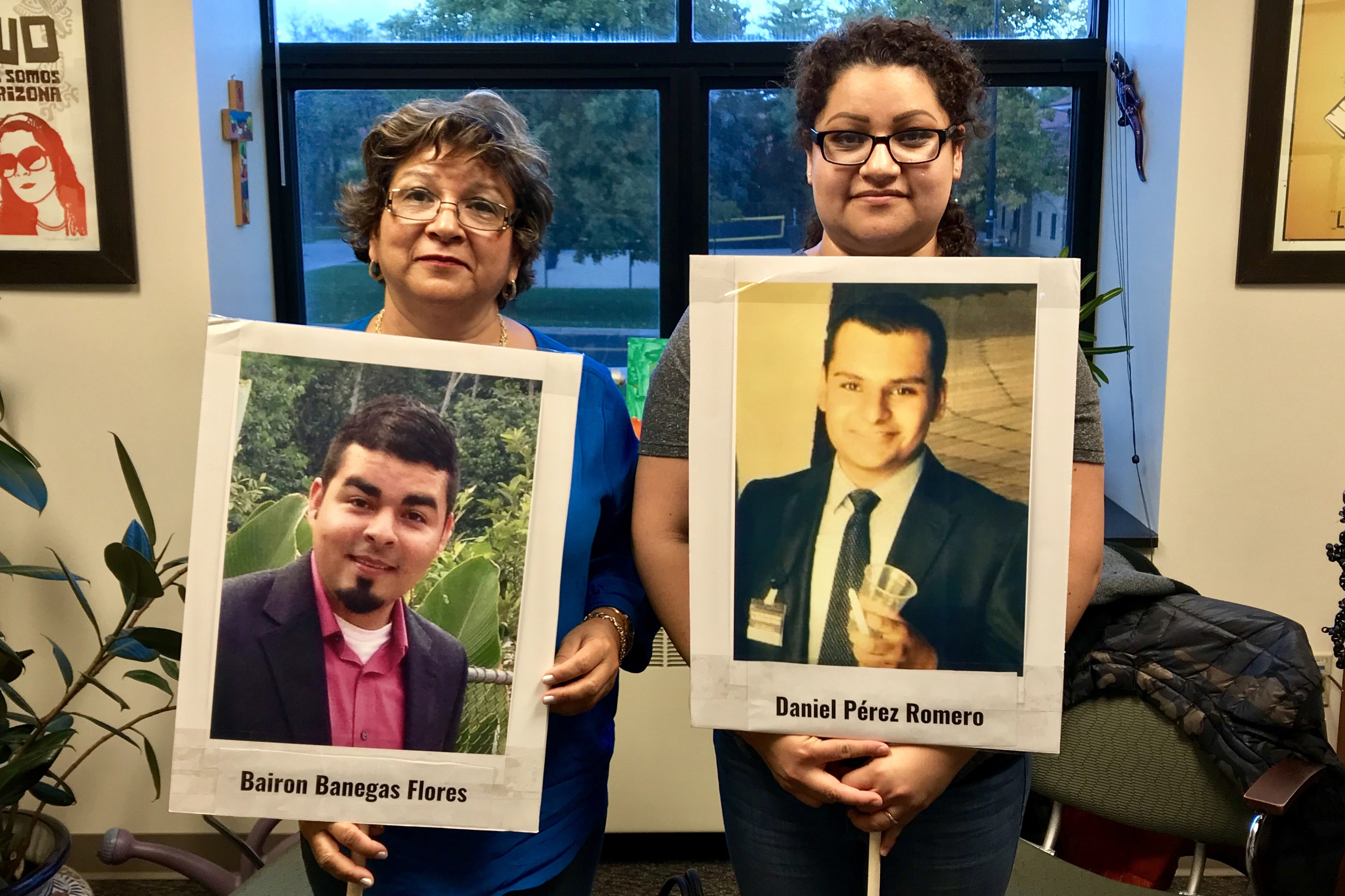 Mirna and Angelica holding photograph posters of their missing loved ones, Bairon Banegas Flores and Daniel Perez Romero, Inter-American Commission on Human Rights Conference, Boulder, Colorado, 2018. © 2018 Private