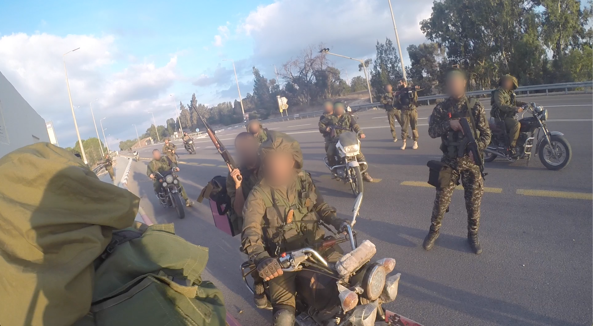 Armed men on motorbikes