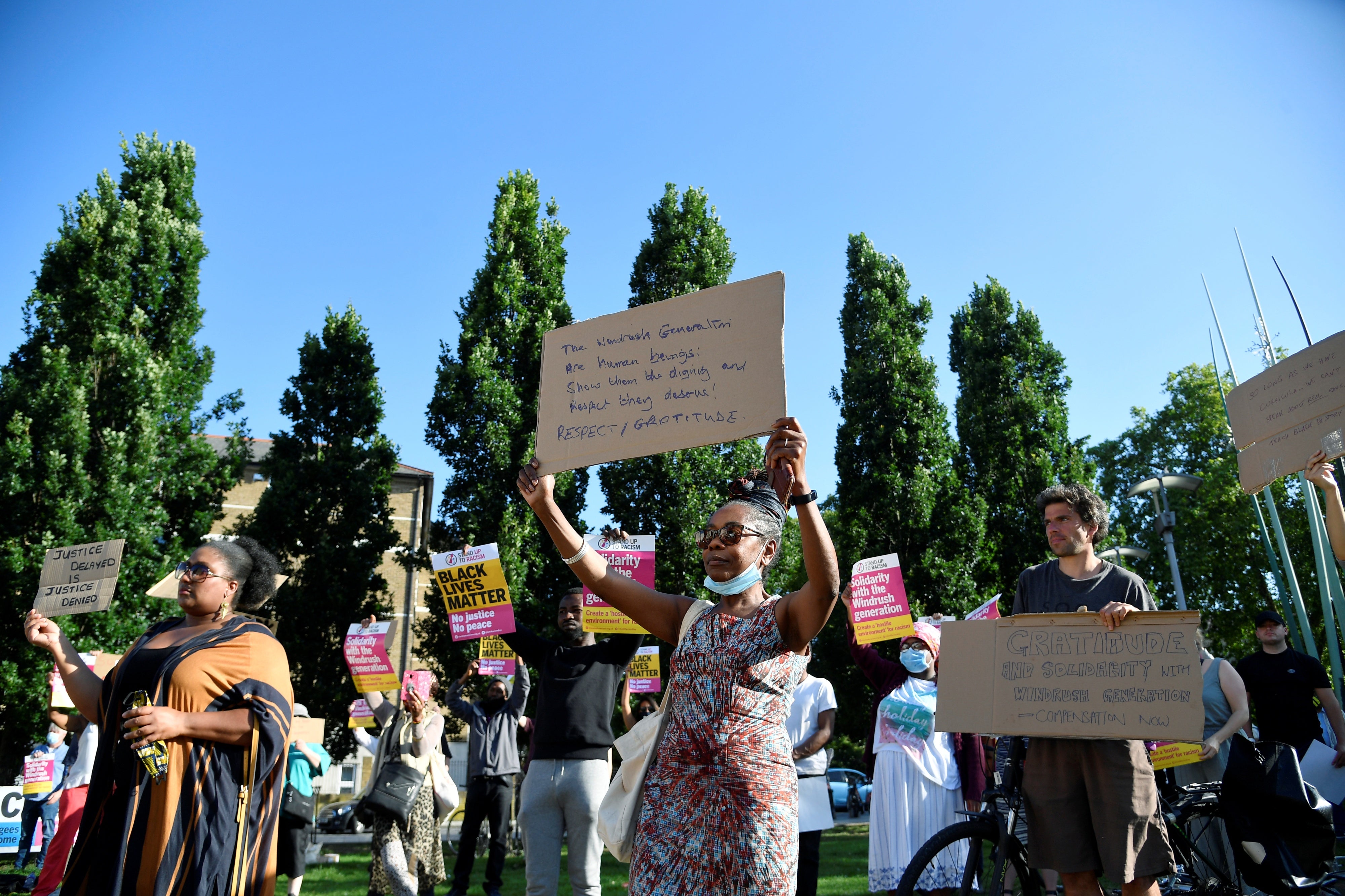 People attend a rally to commemorate Windrush Day, a celebration of the contribution of the Windrush generation in Windrush Square, London, Britain June 22, 2020. 