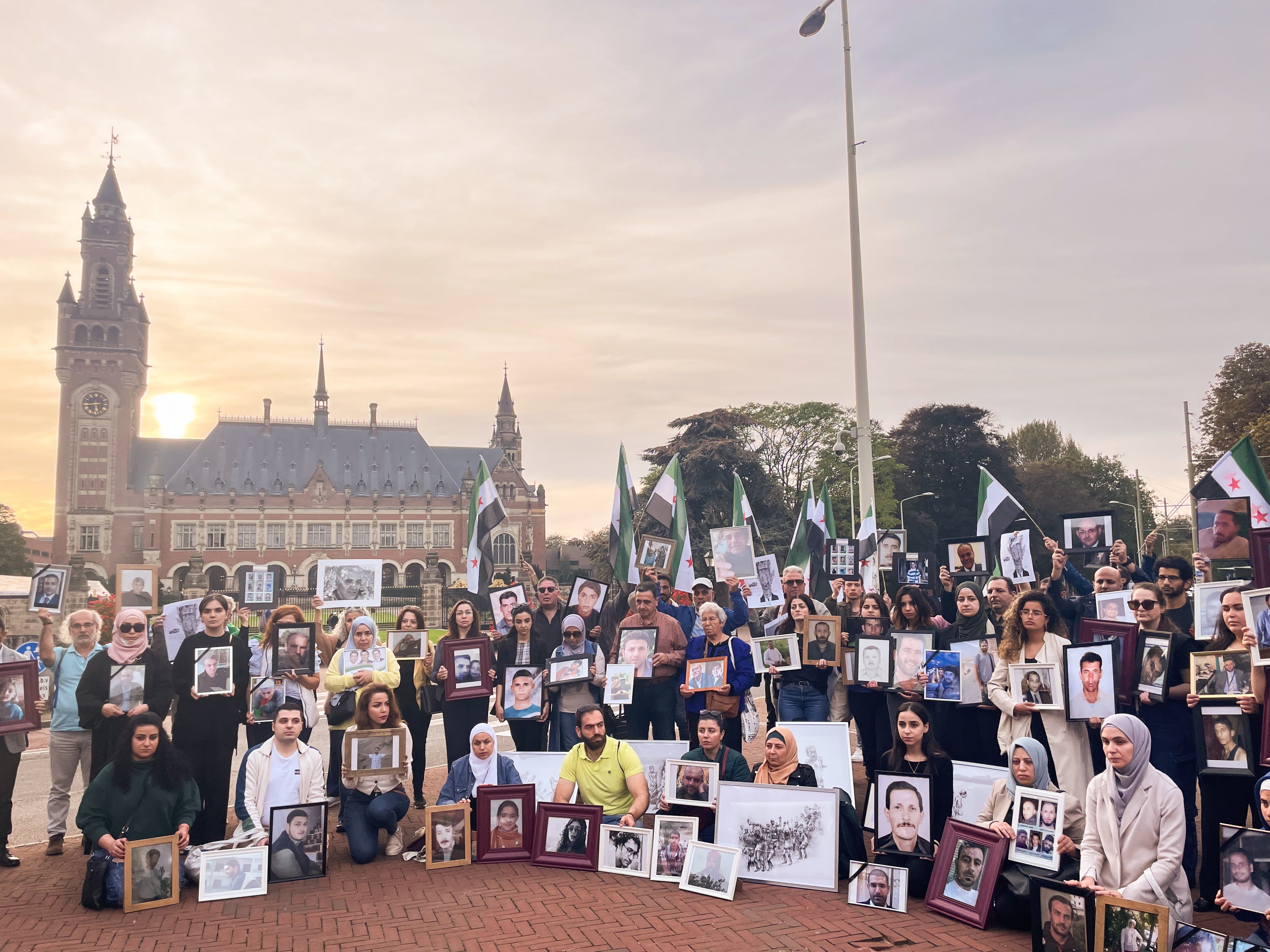 Relatives of Syrians who have been detained or disappeared protest in front of the International Court of Justice in The Hague, Netherlands, on October 10, 2023. 