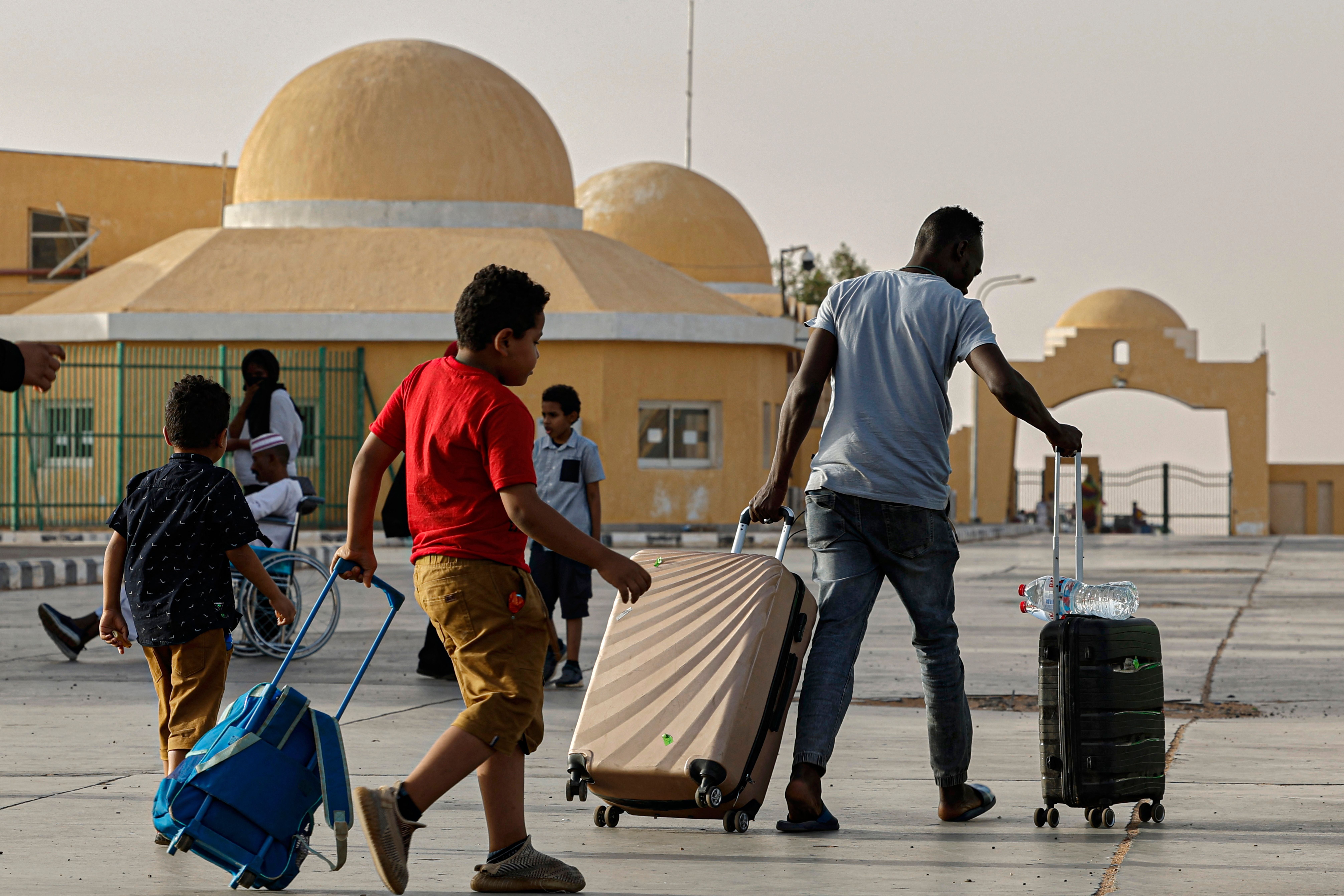 Refugees fleeing conflict in Sudan cross into Egypt through the Argeen Land Port on May 12, 2023. 