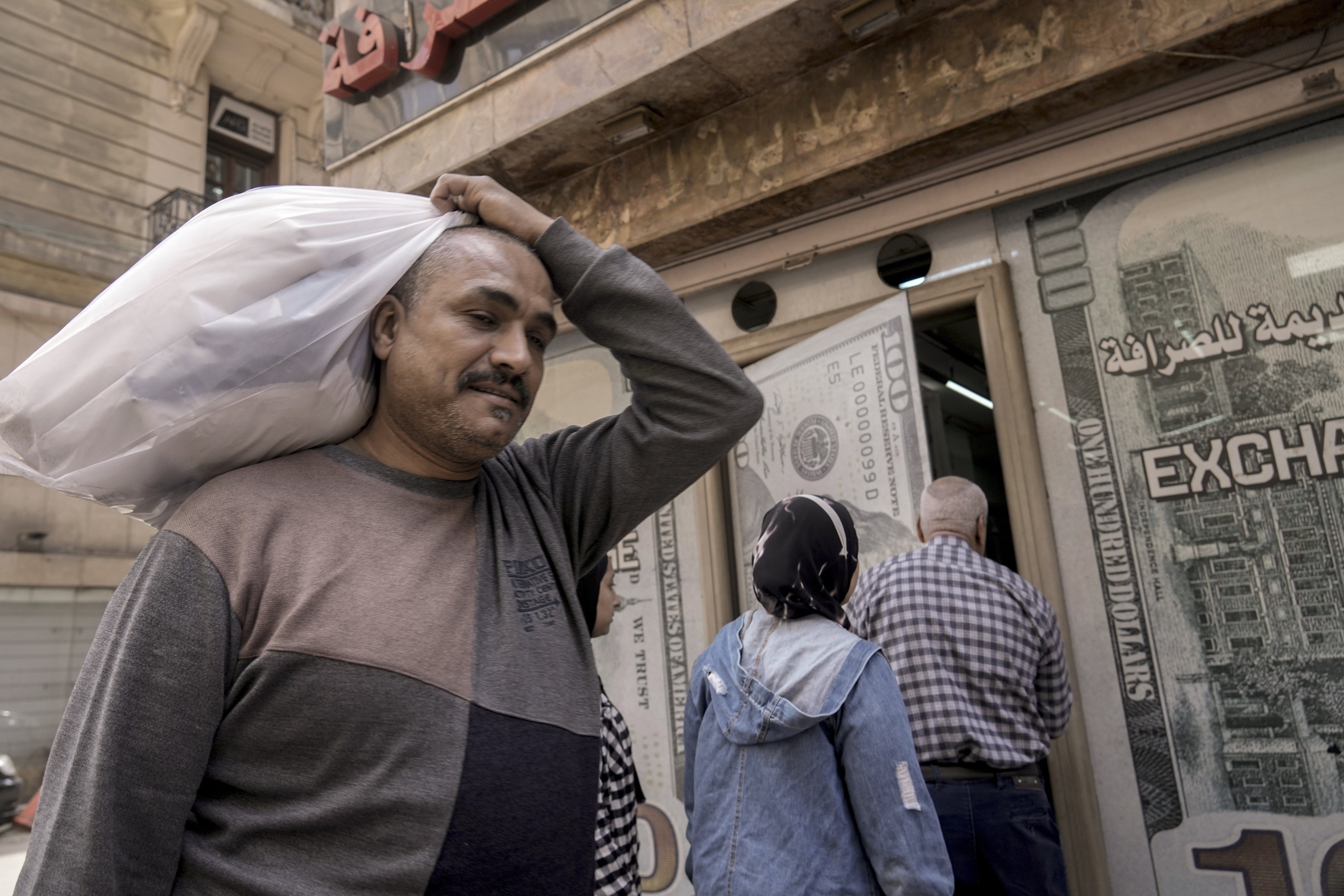 A man walks past an exchange office in Cairo, Egypt, March 6, 2024. 