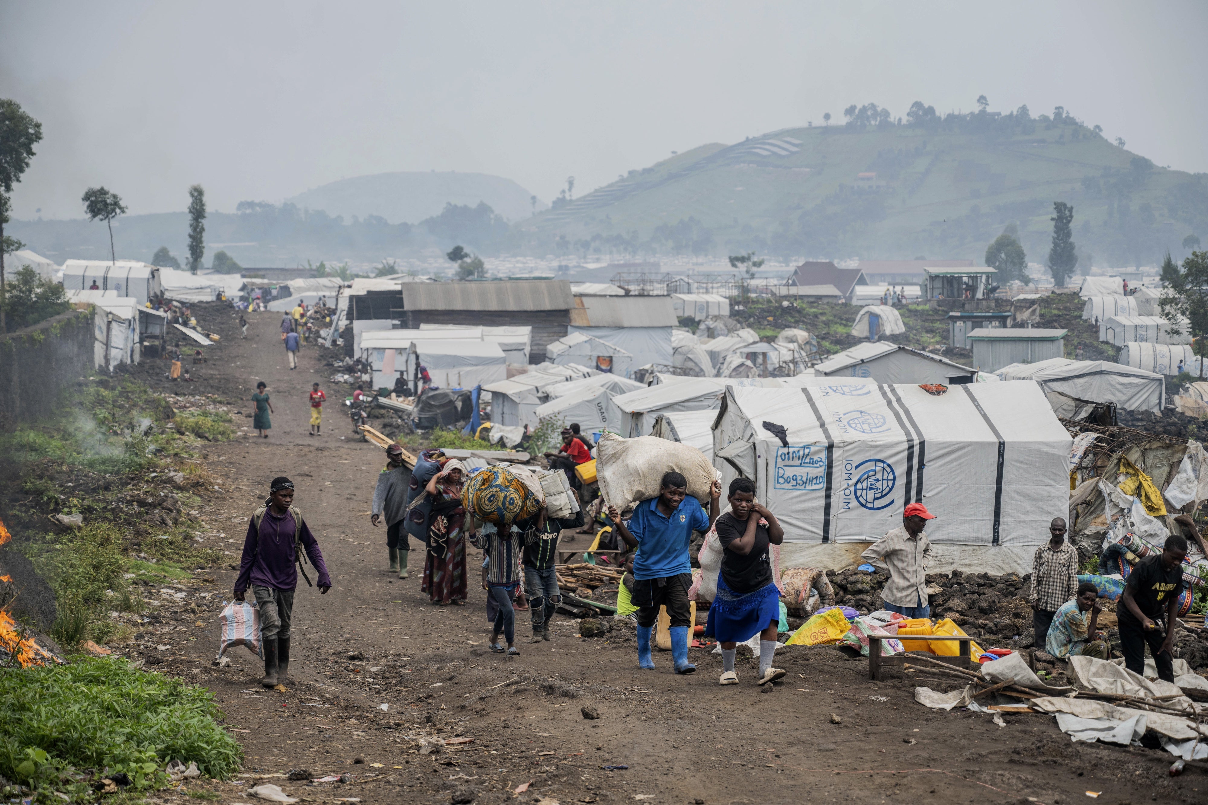 People leaving an IDP camp near Goma.