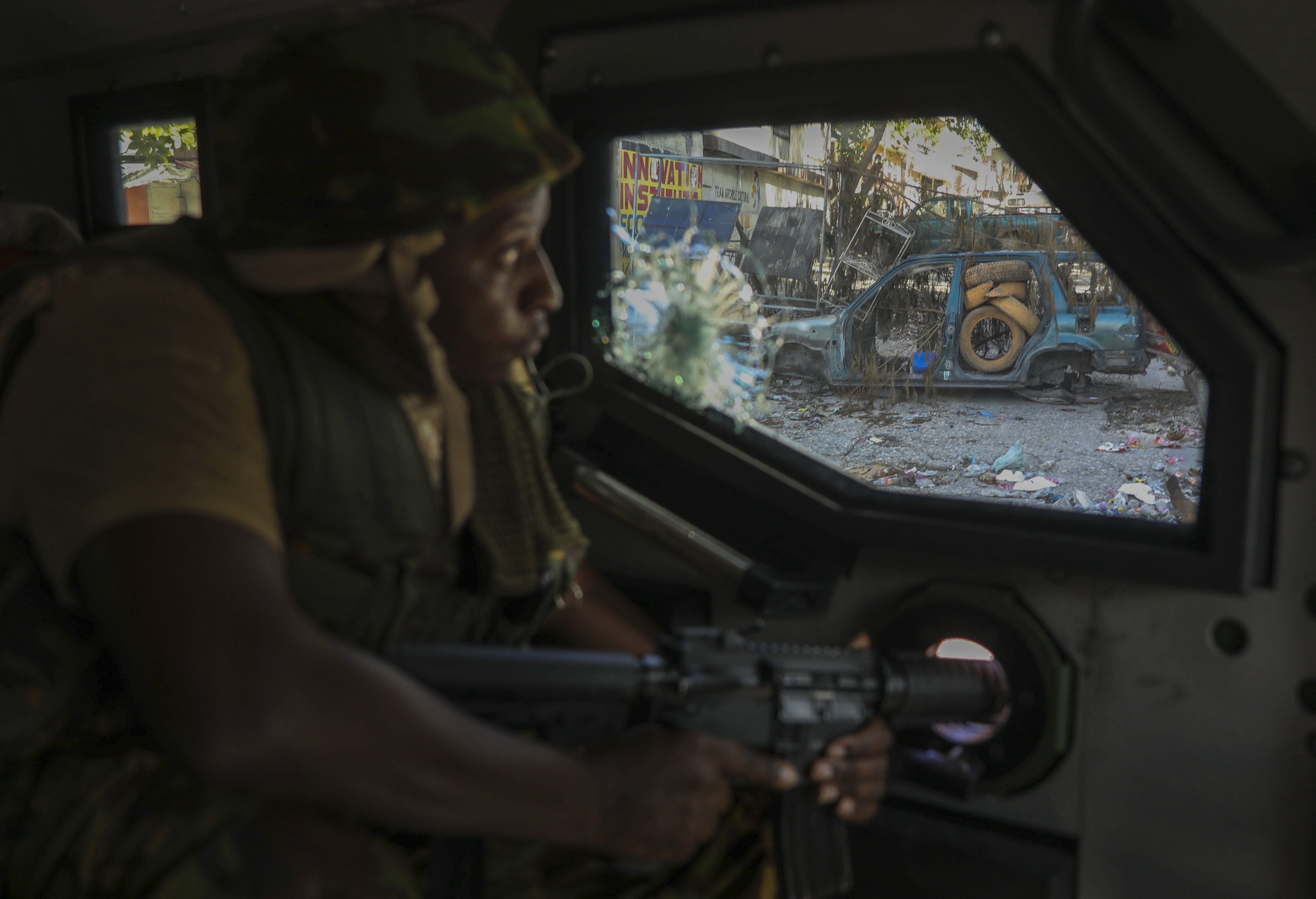 A Kenyan police officer, part of a UN-backed multinational force, patrols a street in Port-au-Prince, Haiti, December 5, 2024.