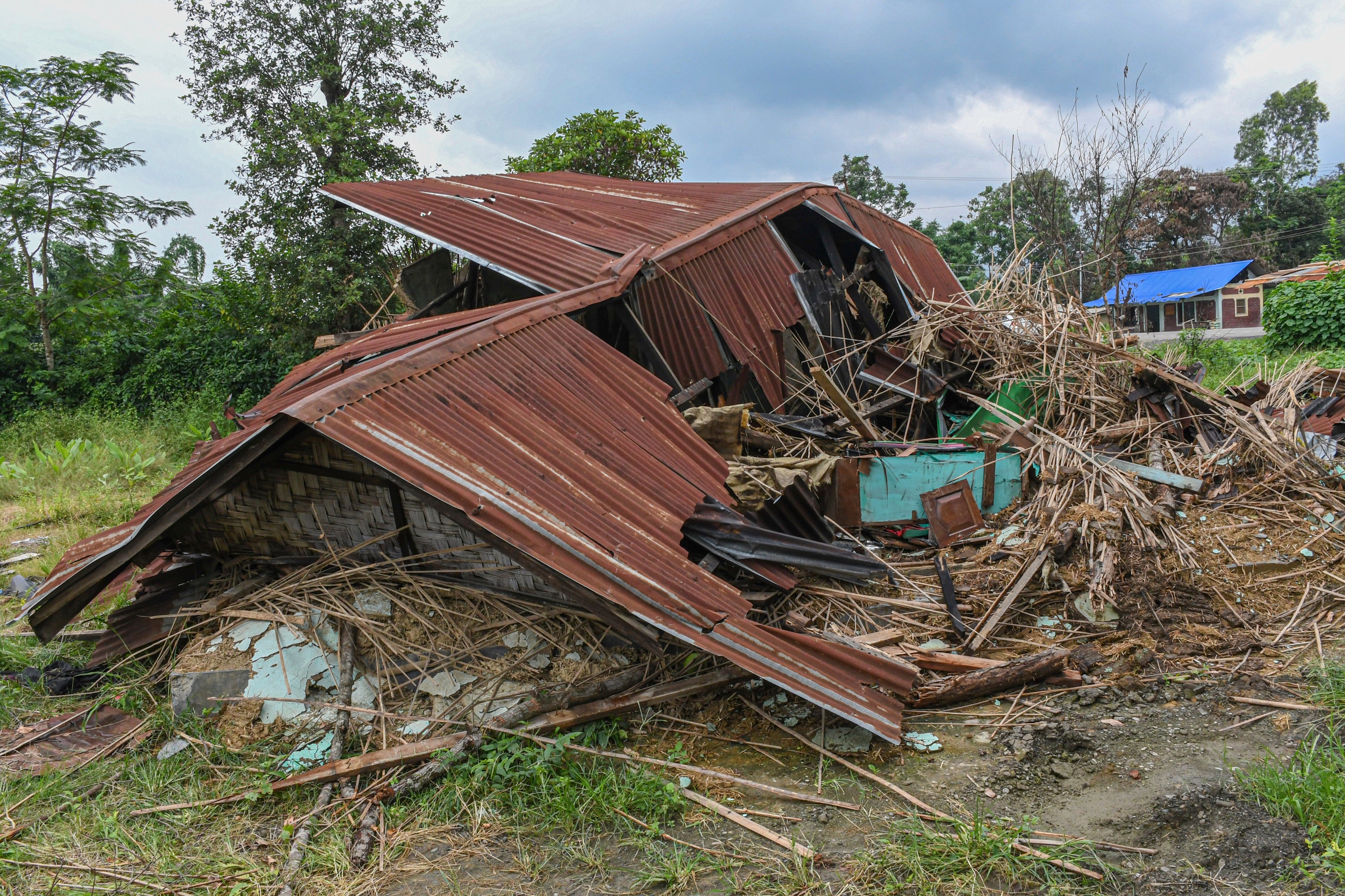 A destroyed house after clashes between Meiteis and Kukis along a highway in Torbung village in Churachandpur district, Manipur, May 3, 2023. 