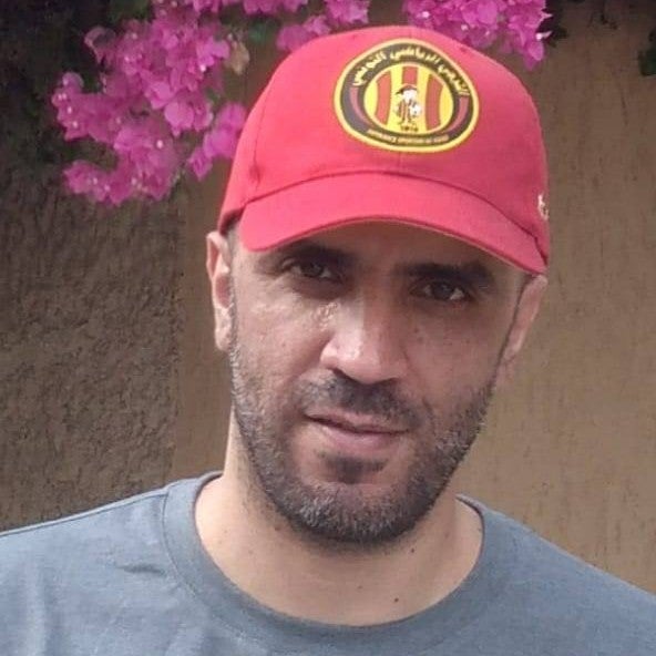 Photo of a man in a baseball cap