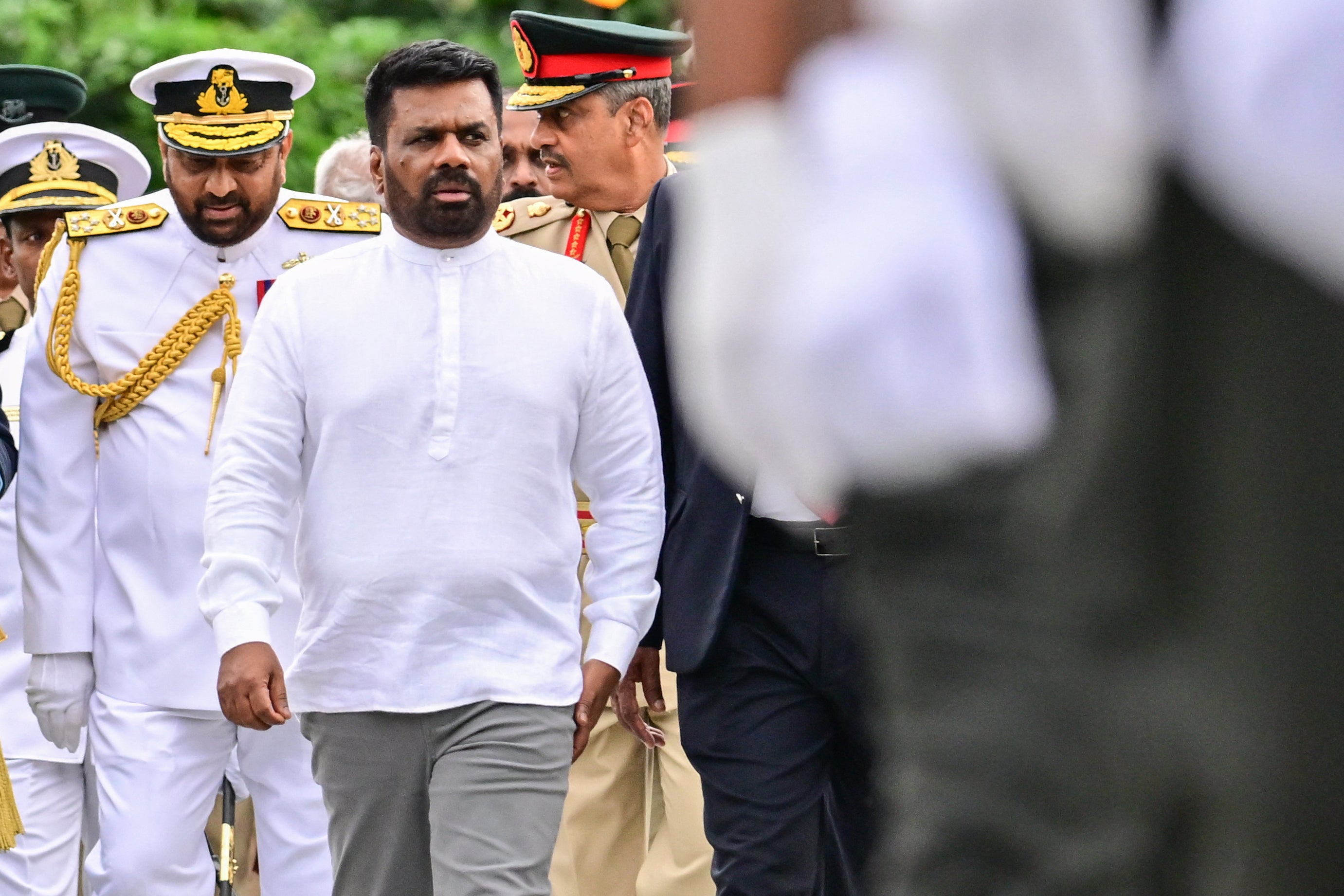 Sri Lankan President Anura Kumara Dissanayake (C) during a ceremony to commemorate the 16th anniversary of National War Heroes Day, marking the end of the country’s civil war, in Colombo,  May 19, 2025.