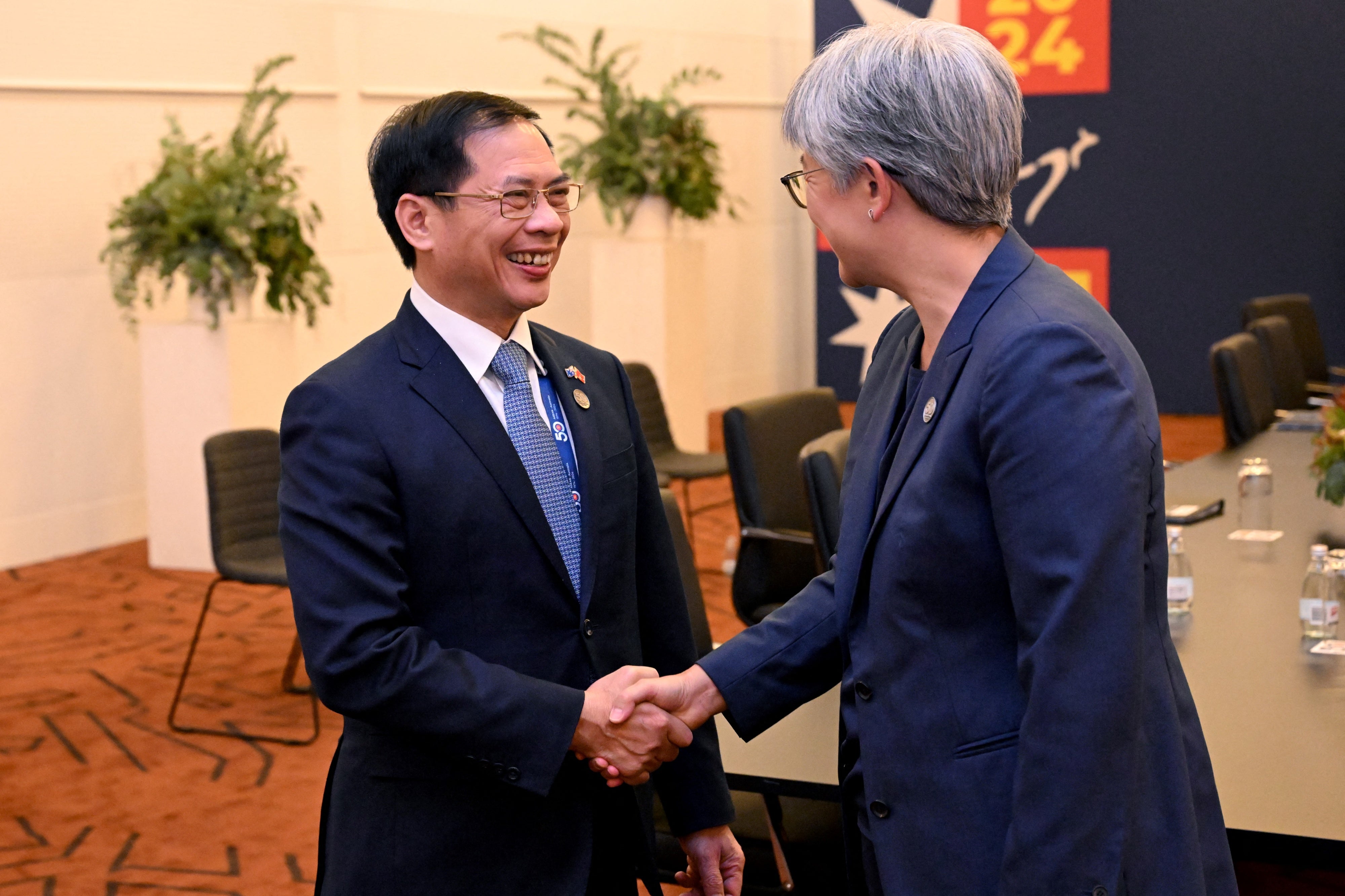 Australia's Foreign Minister Penny Wong (R) greets Vietnam's Foreign Minister Bui Thanh Son (L) during the 50th ASEAN-Australia Special Summit in Melbourne on March 5, 2024.