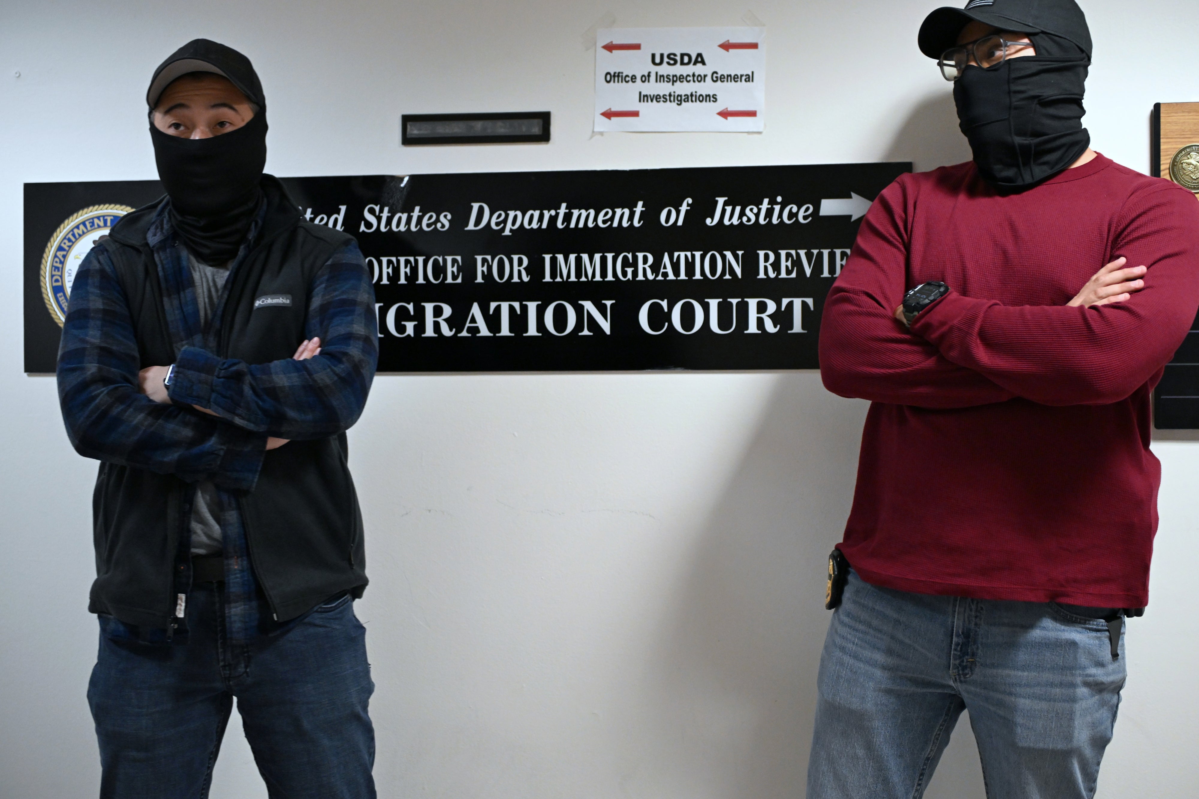 Masked US federal agents outside the immigration court in Manhattan's 26 Federal Plaza, New York City, October 31, 2025.
