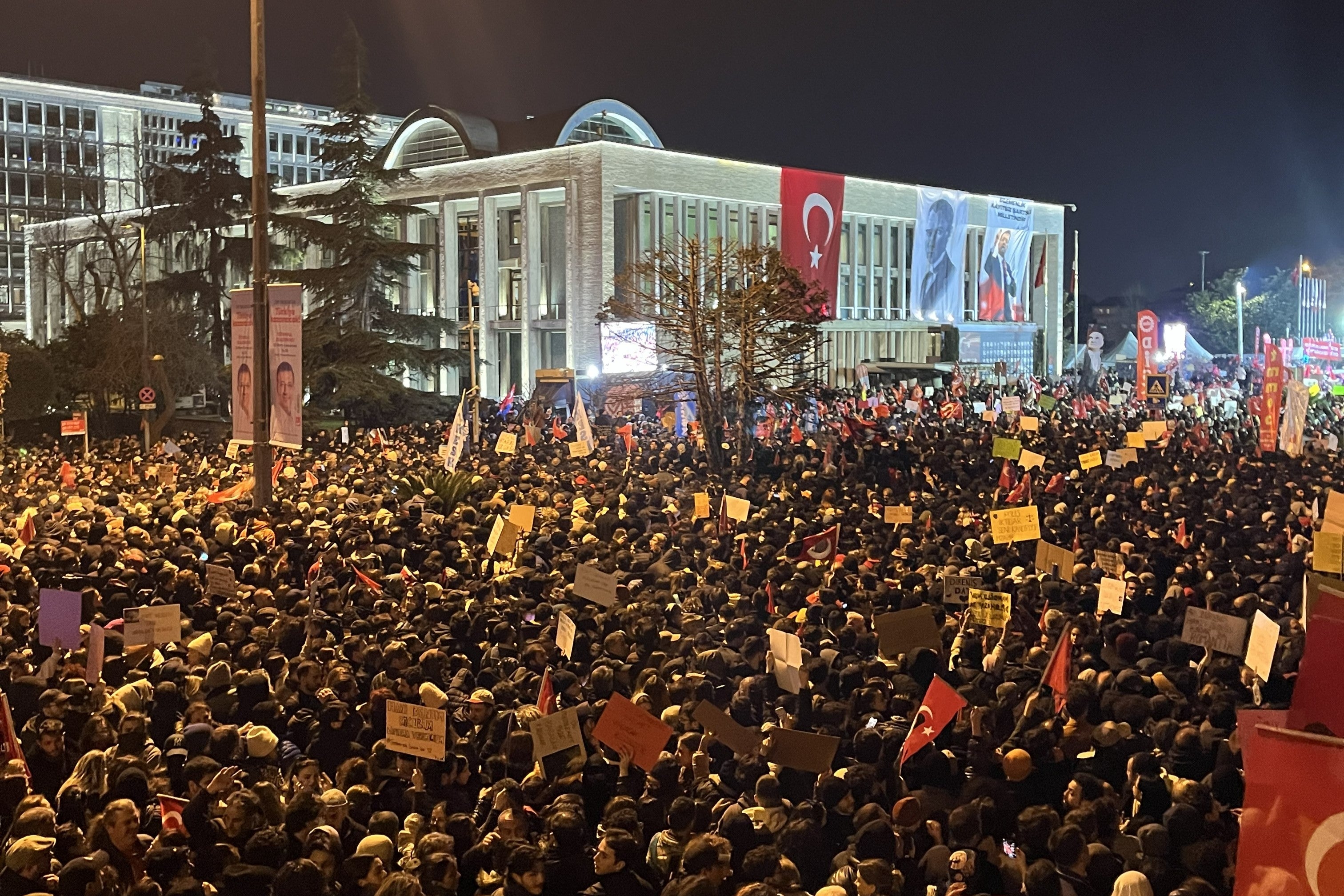 People gather outside the Istanbul municipality building in Istanbul, Türkiye, to protest the arrest of mayor Ekrem İmamoğlu, March 22, 2025. 