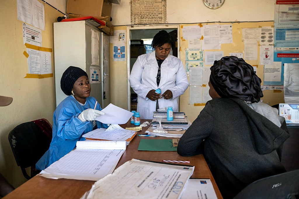 A patient receives a reduced supply of medication for HIV treatment, following the cut of USAID funds for treatment programs in Democratic Republic of Congo, July 31, 2025.