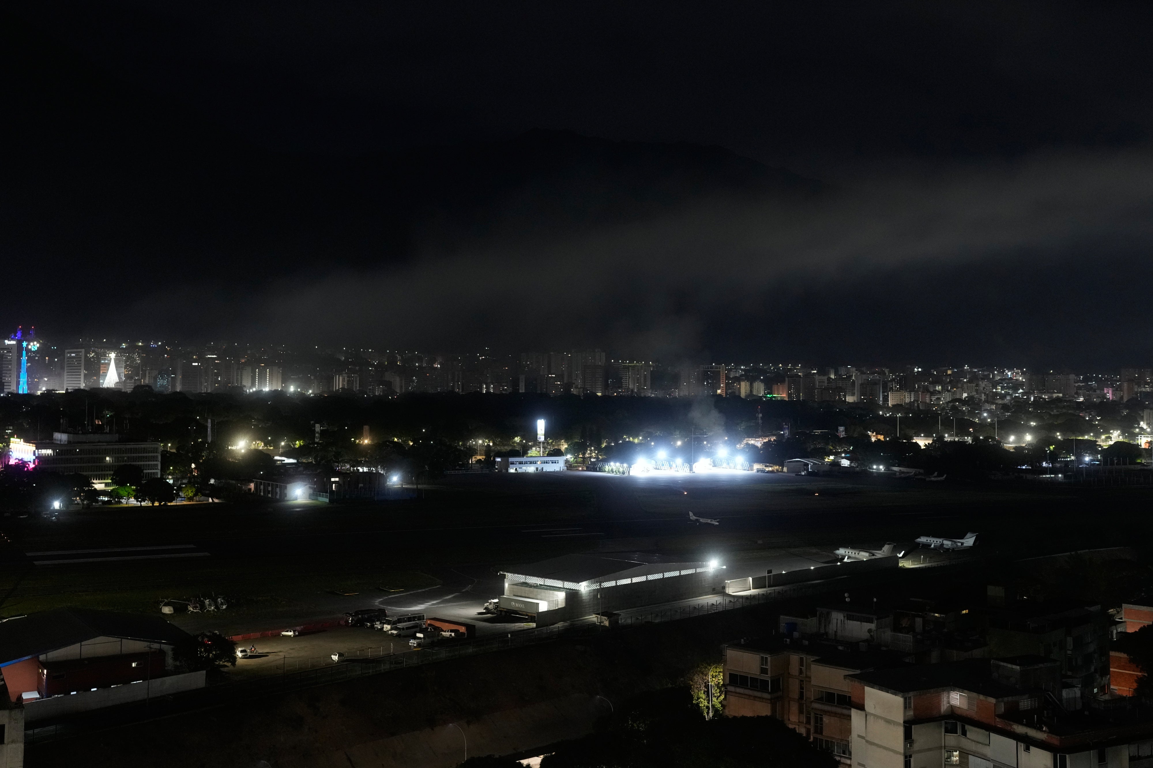 Smoke rises over an airport in Caracas, Venezuela