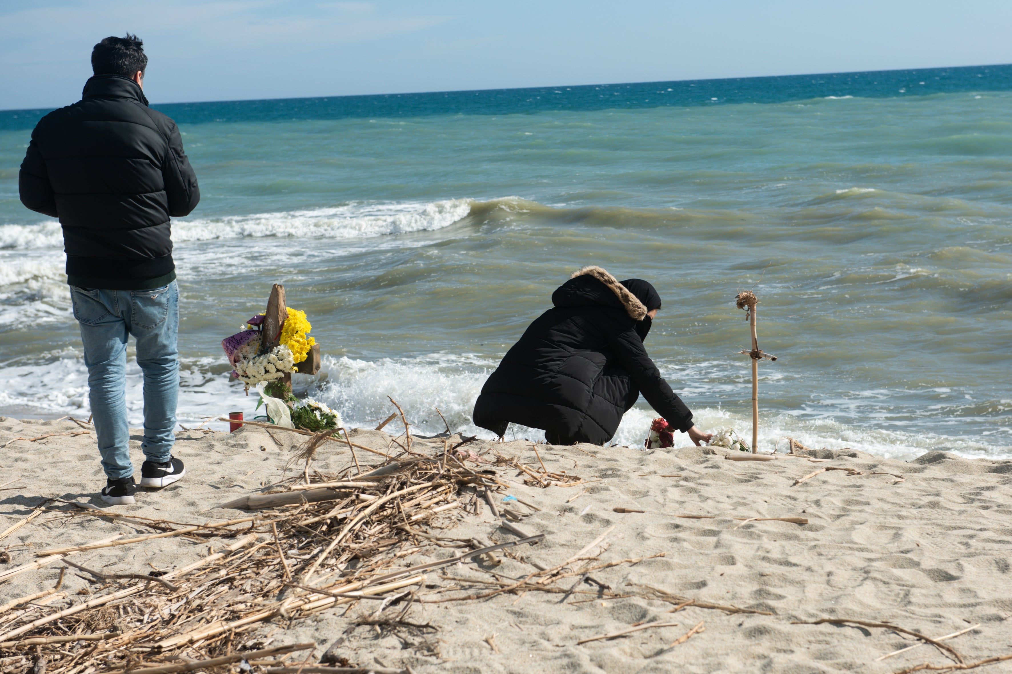 Relatives of a person who went missing after a migrant boat sank on February 26 on the beach near where the shipwreck took place off the coast of Steccato di Cutro, near Crotone, in Calabria in southern Italy. March 7, 2023. 