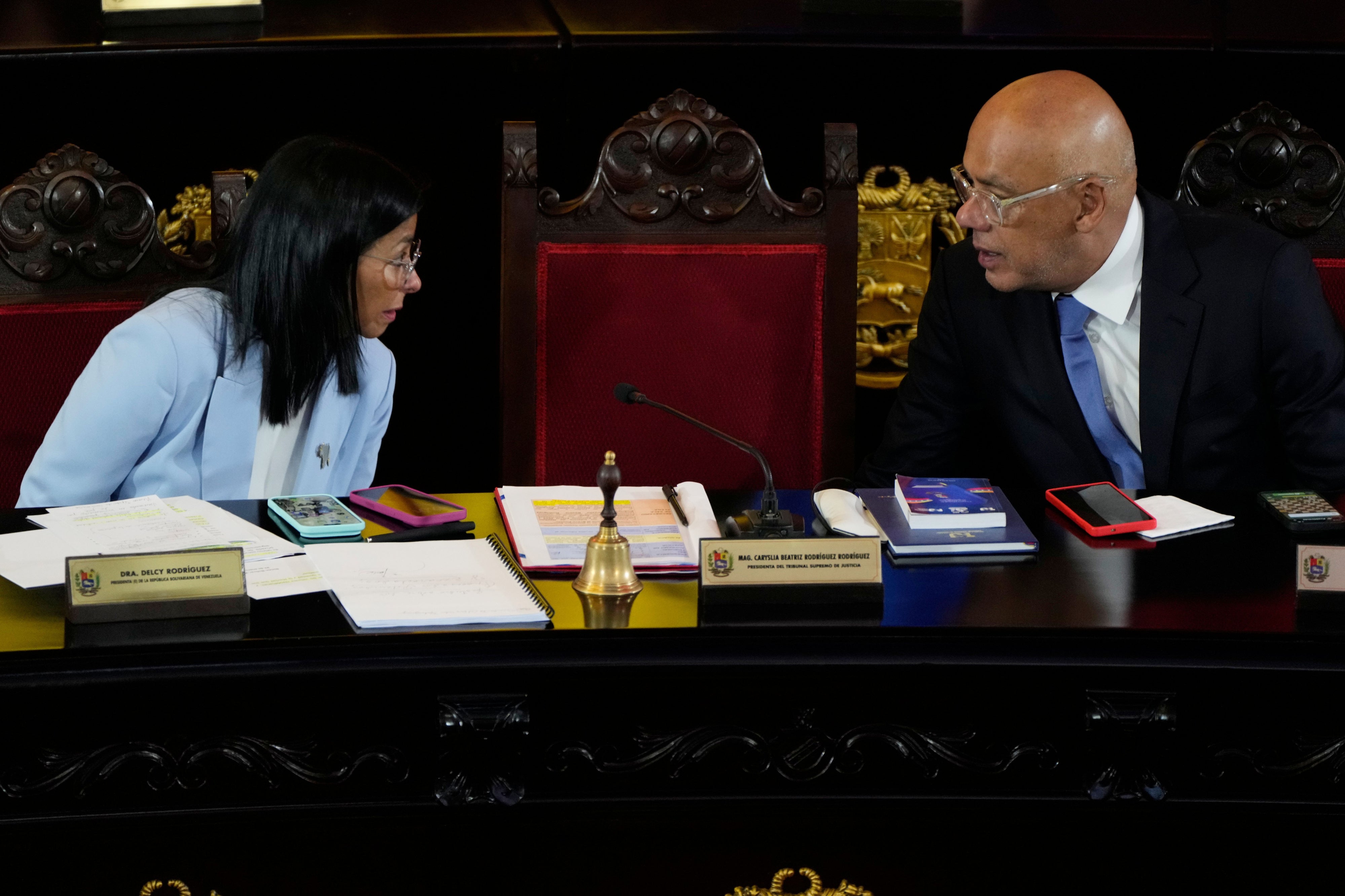 Venezuelan acting President Delcy Rodriguez speaks with her brother, National Assembly President Jorge Rodriguez, during a ceremony marking the opening of the new judicial year at the Supreme Tribunal of Justice in Caracas, Venezuela, January 30, 2026.