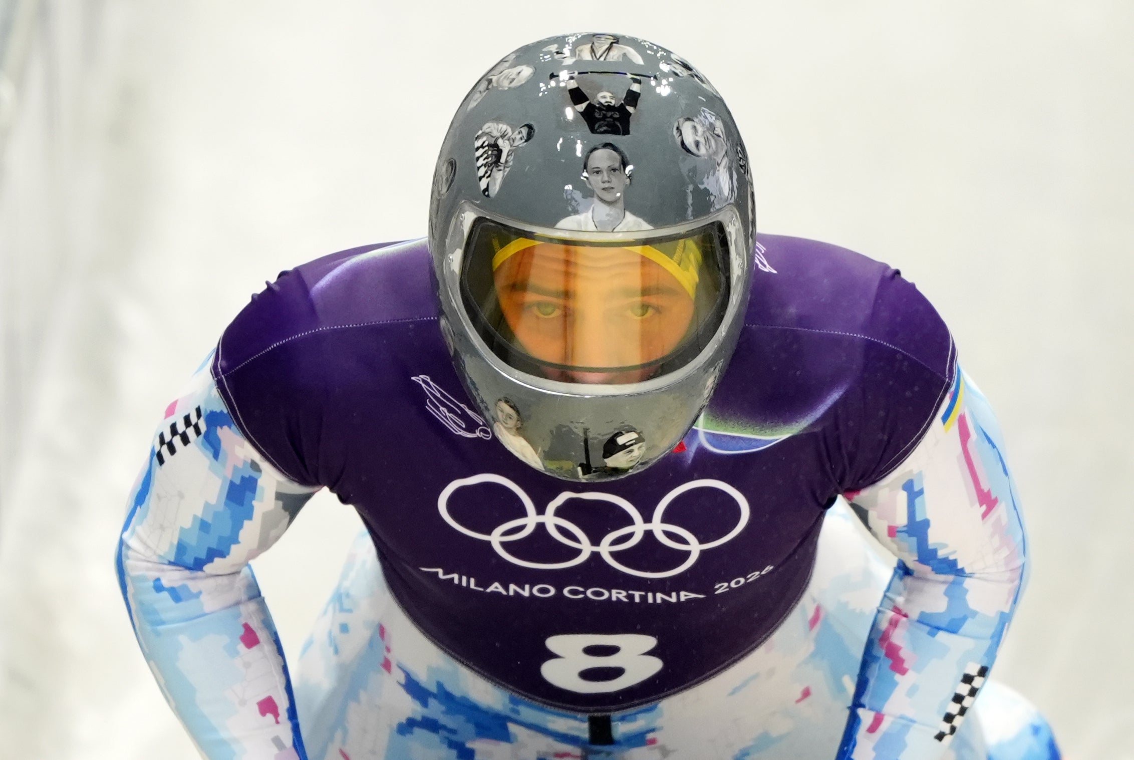 Ukraine’s Vladyslav Heraskevych wearing a helmet honoring Ukrainian athletes killed since Russia’s full-scale invasion of Ukraine during skeleton training at the 2026 Winter Olympics, Italy, February 9, 2026.