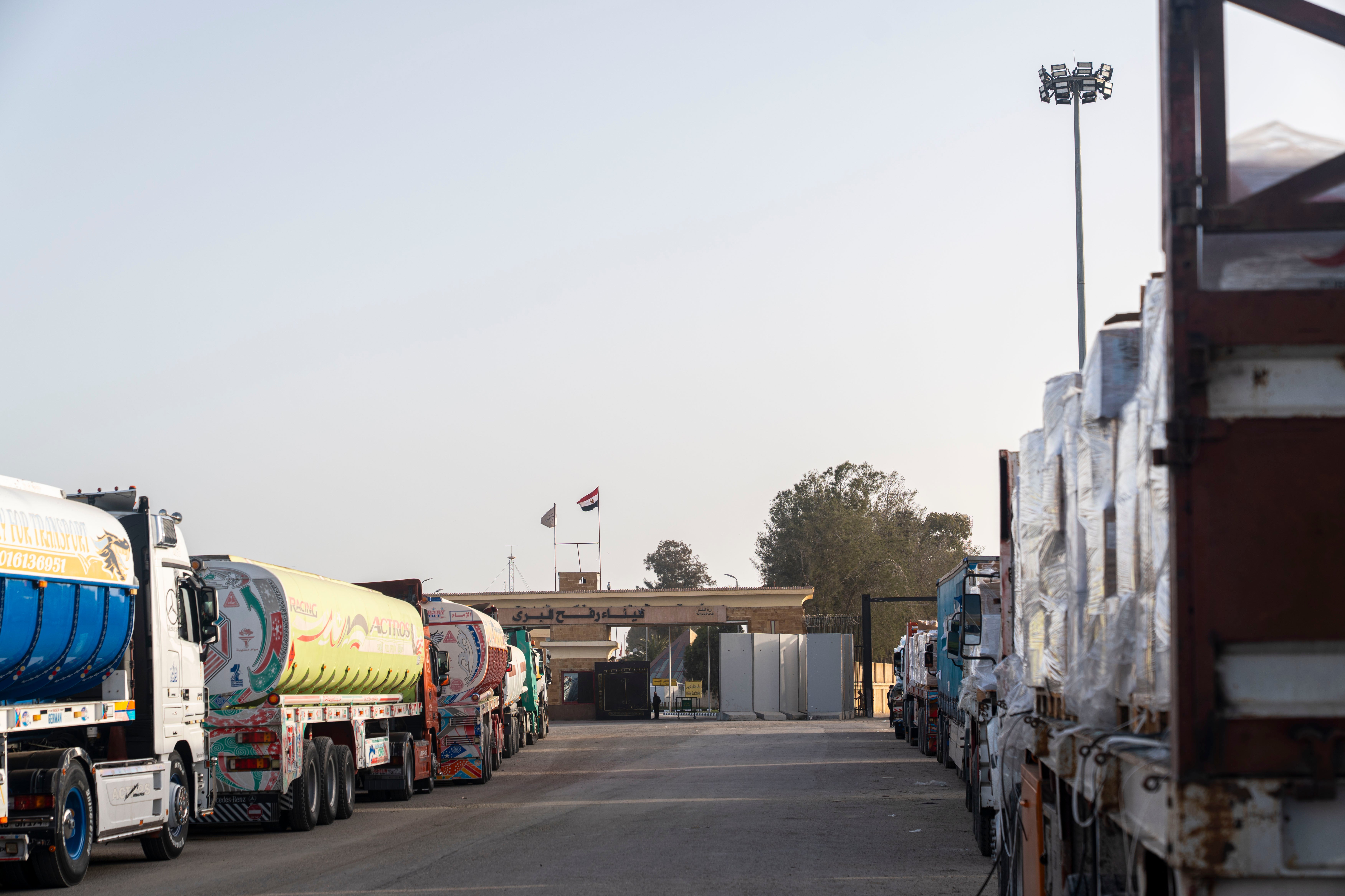 Trucks carrying humanitarian aid wait in Egypt at the Rafah crossing to enter Gaza on January 27, 2026. 