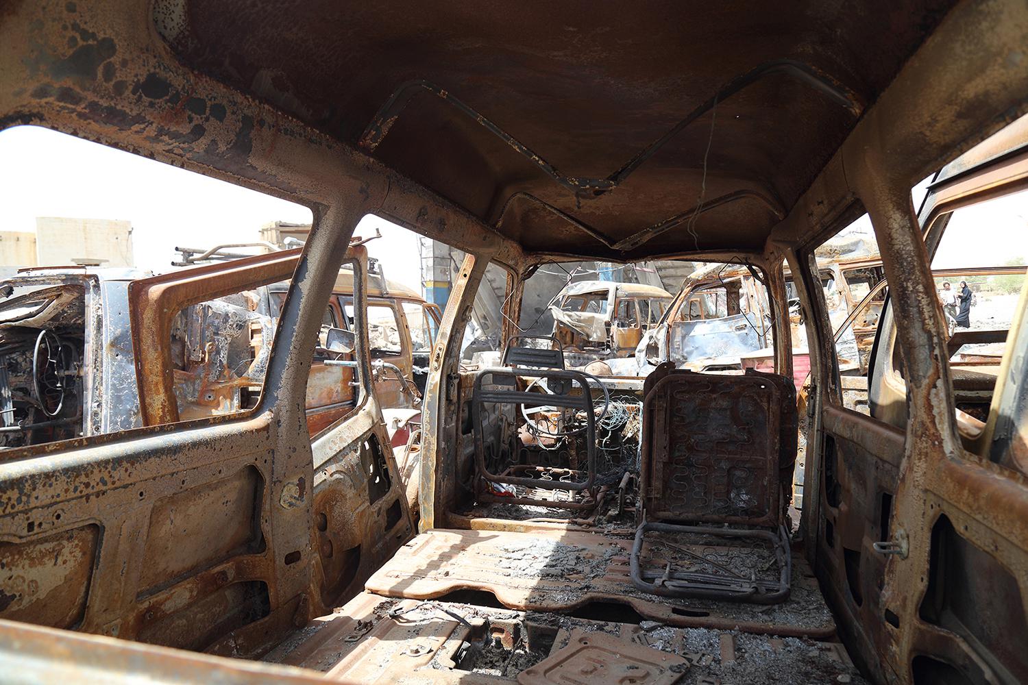 Burned-out cars lined up by the Jarman petrol station, which was struck in an aerial attack on April 15, 2015.